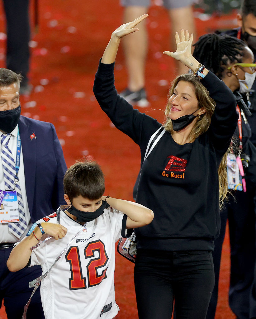 Gisele Bundchen, wife of Tom Brady #12 of the Tampa Bay Buccaneers, celebrates with Benjamin Brady after the Buccaneers defeated the Kansas City Chiefs 31-9 in Super Bowl LV at Raymond James Stadium on February 07, 2021 in Tampa, Florida. (Photo by Kevin C. Cox/Getty Images)