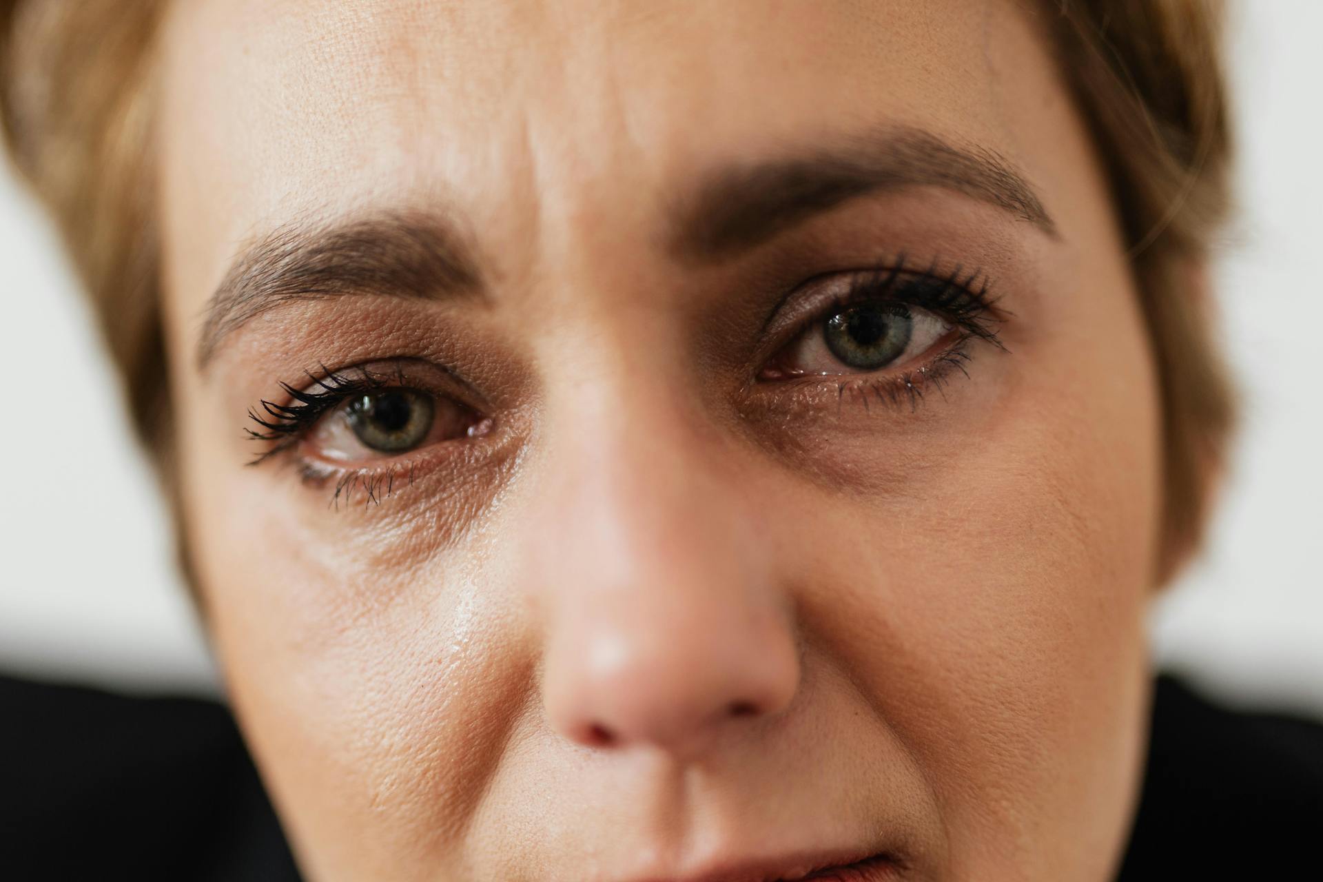 Close-up of a teary-eyed womans face | Source: Pexels