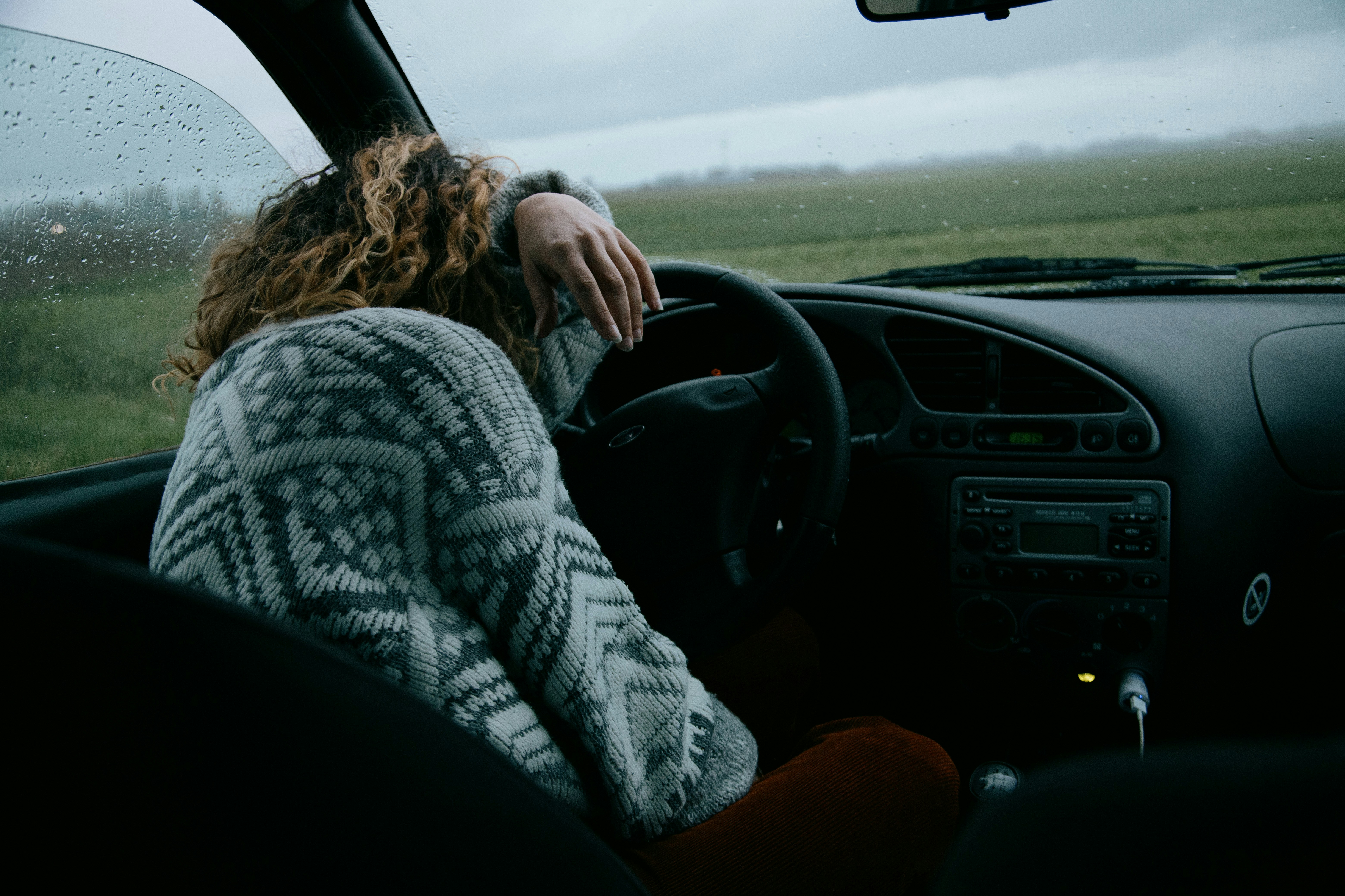 A woman crying in a car | Source: Unsplash