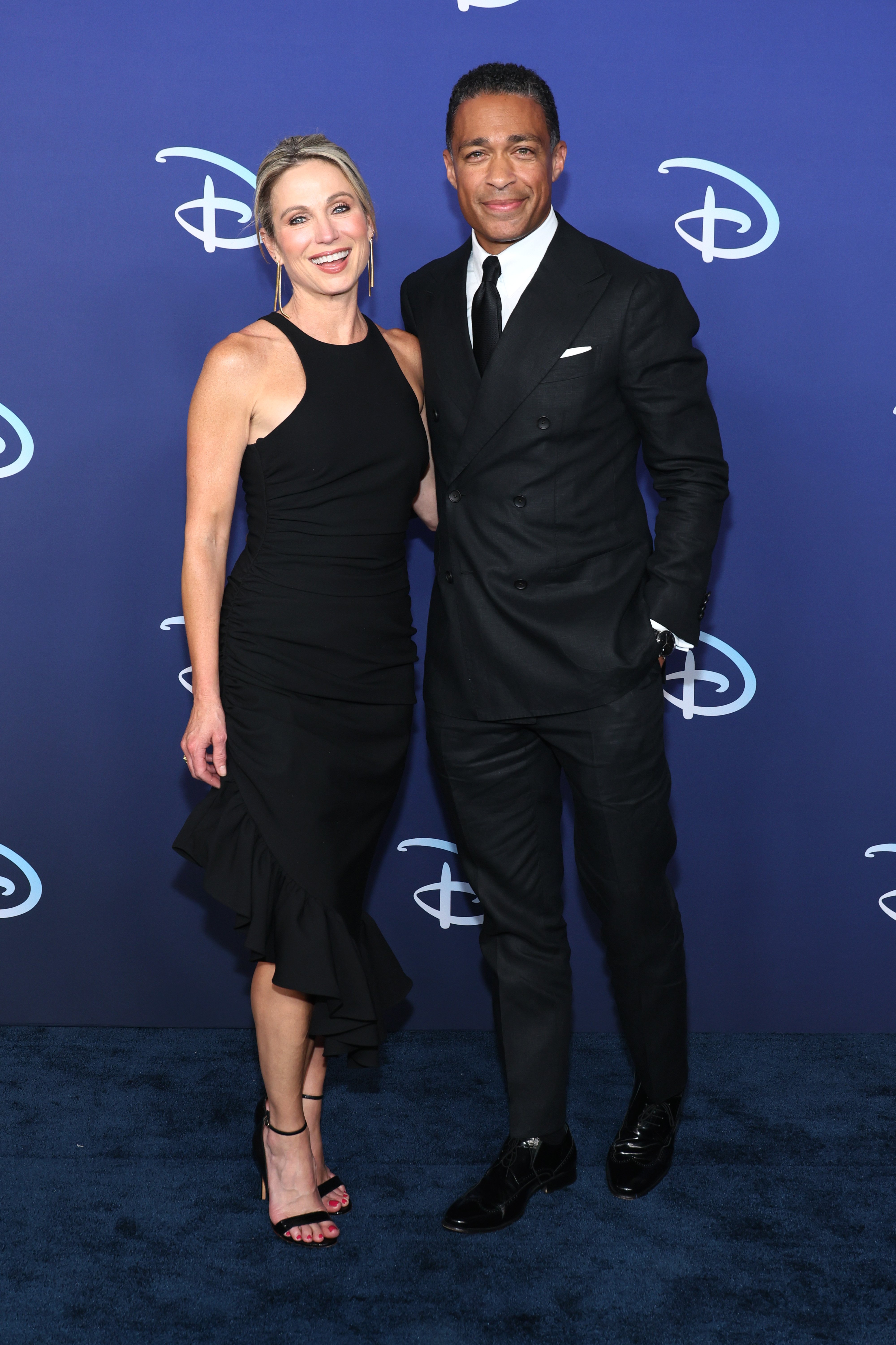 Amy Robach and TJ Holmes attend the 2022 ABC Disney Upfront at Basketball City - Pier 36 - South Street in New York City on May 17, 2022. | Source: Getty Images
