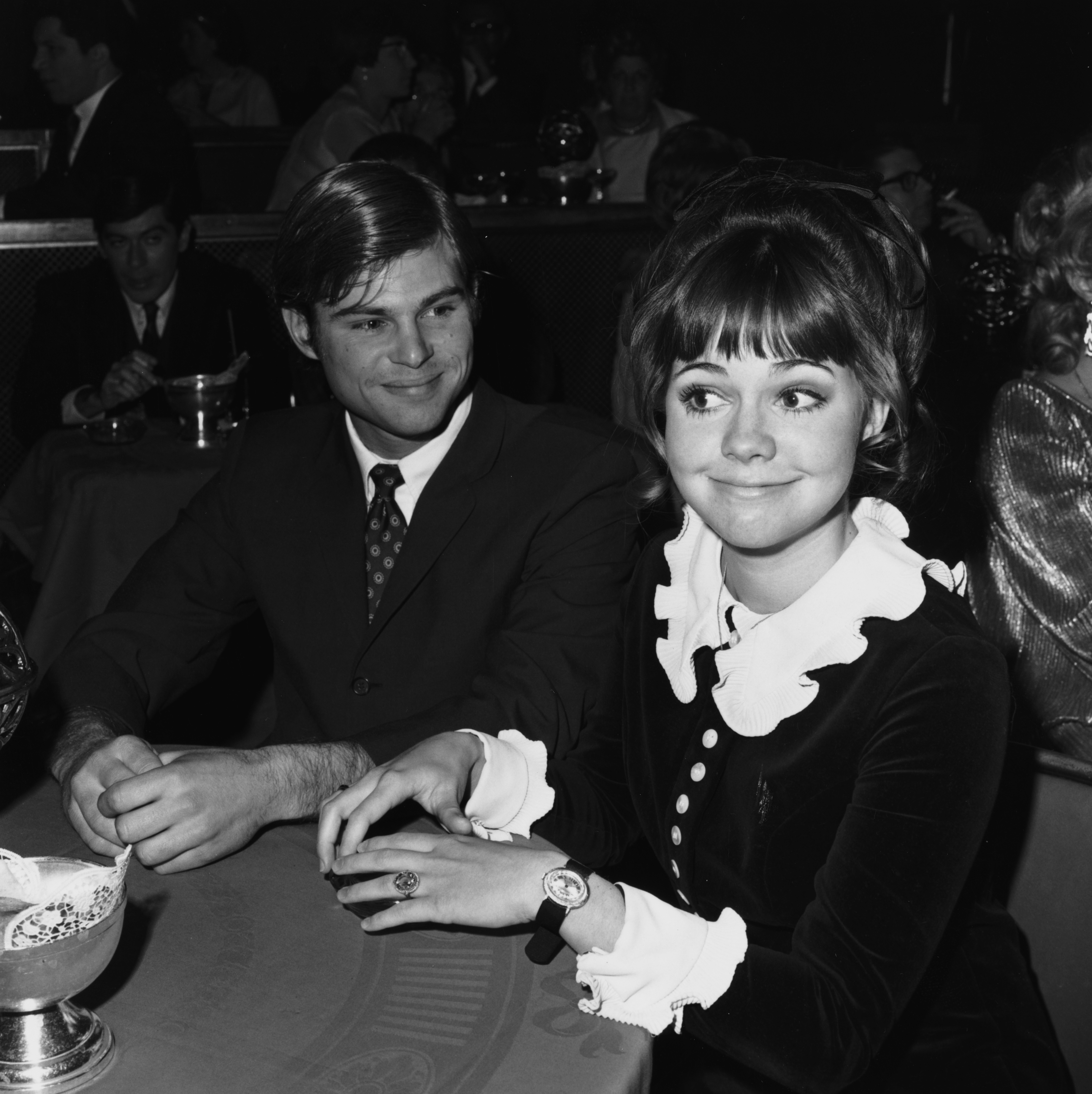 Actors Sally Field and Steven Craig sitting together at the Golden Globe Nominations party, circa 1968 | Source: Getty Images
