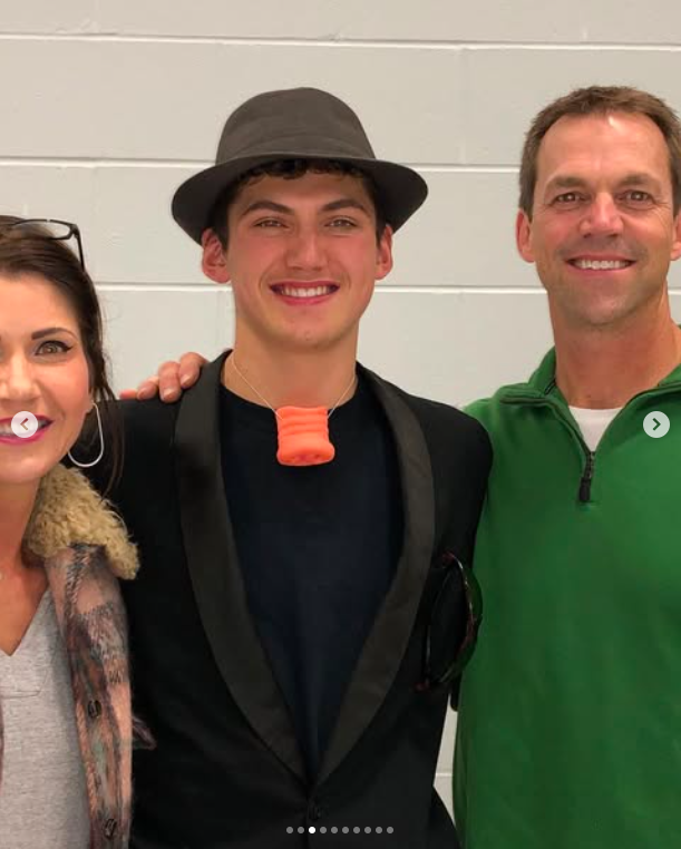Kristi and Bryon Noem with their son, Booker Noem, posted on May 21, 2022. | Source: Instagram/sdbryonnoem
