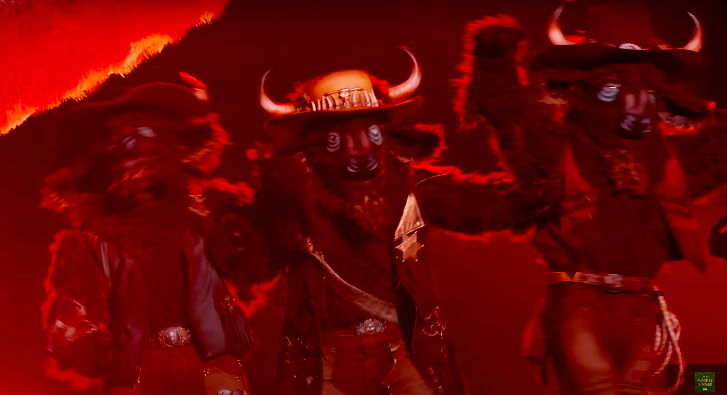 The Buffalos after hearing they won the competition. | YouTube/The Masked Singer