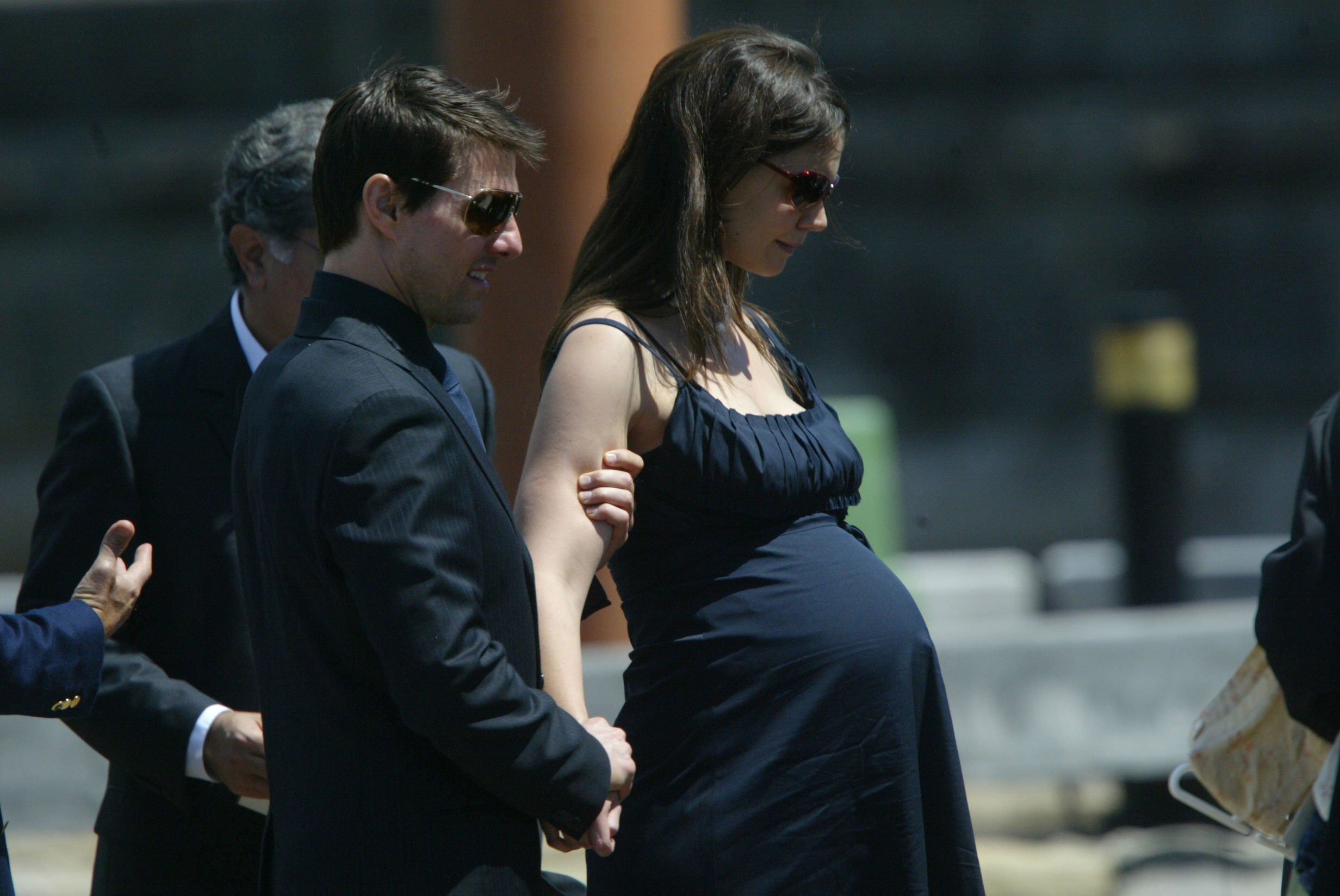 Tom Cruise and his pregnant fiancée Katie Holmes leave a memorial service at the Sydney Opera House in 2006. | Source: Getty Images