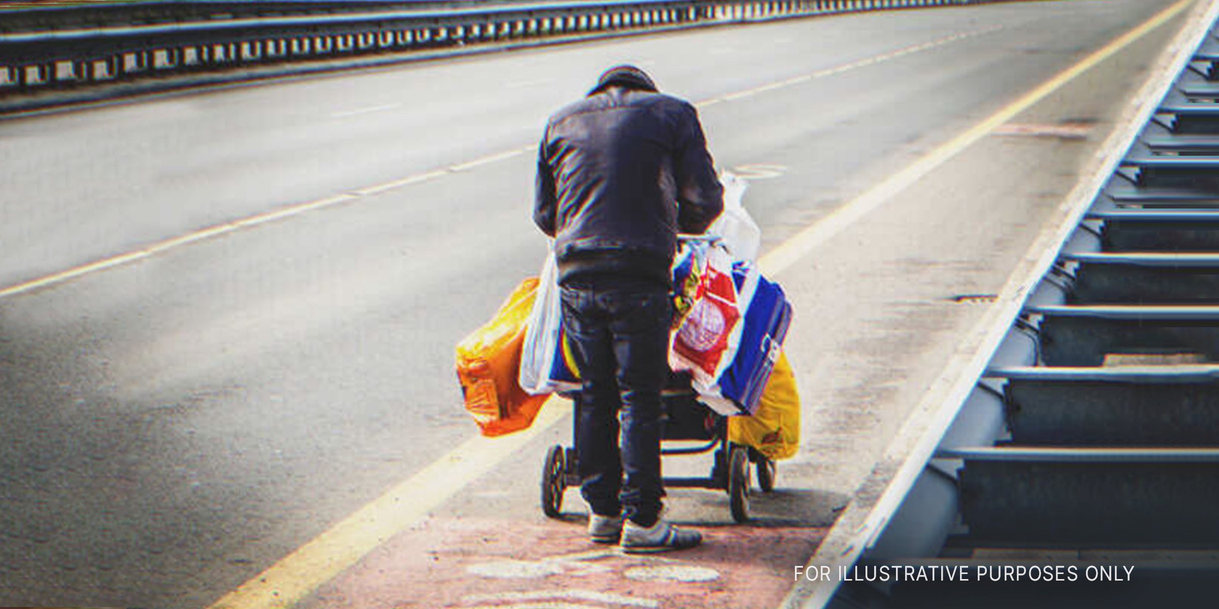 Man pushing cart of belongings. | Source: Shutterstock