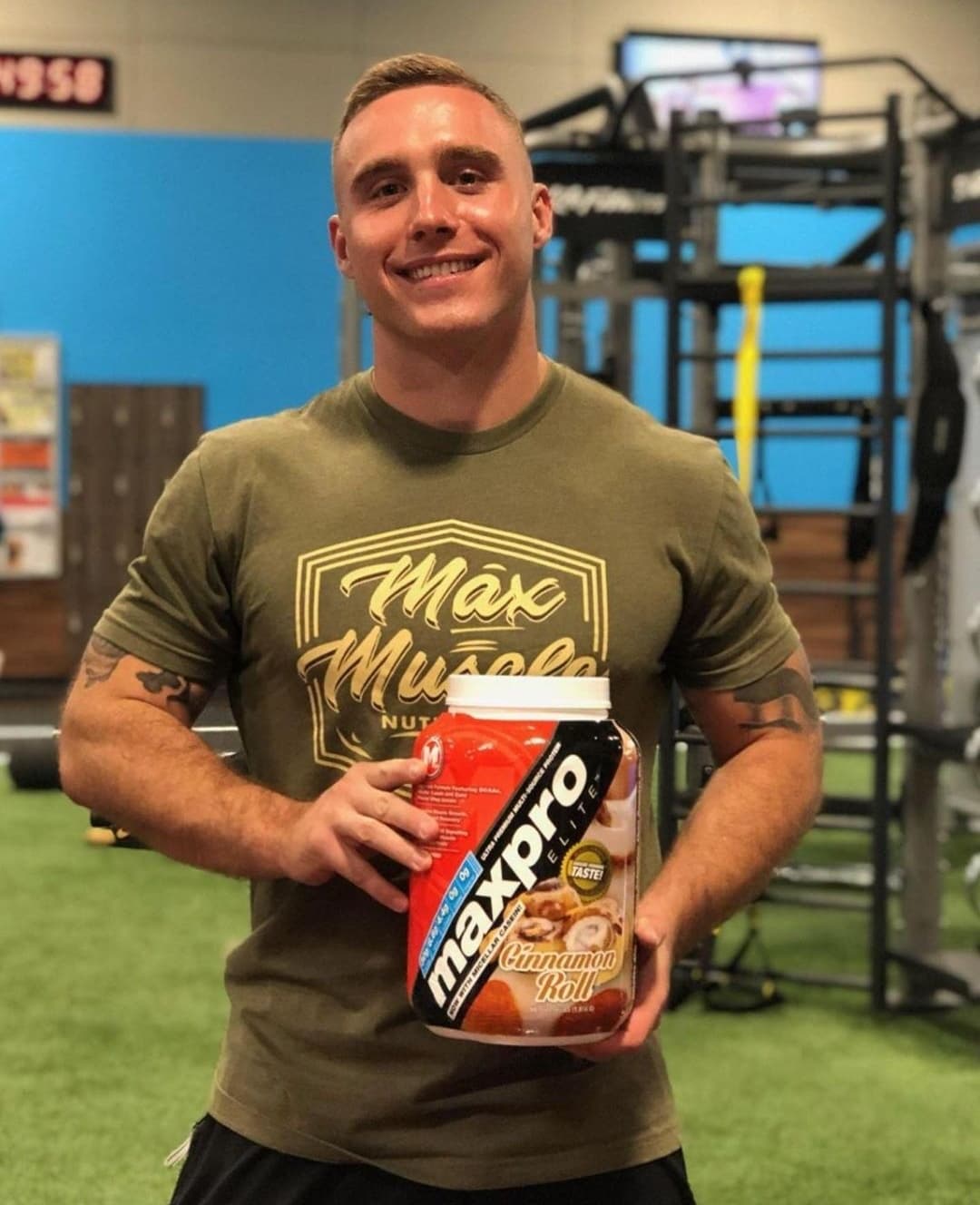 Child actor Lorenzo Brino posing for the camera inside a gym while holding a jar of MaxPro Elite protein | Photo: Instagram.com/mimi_brino