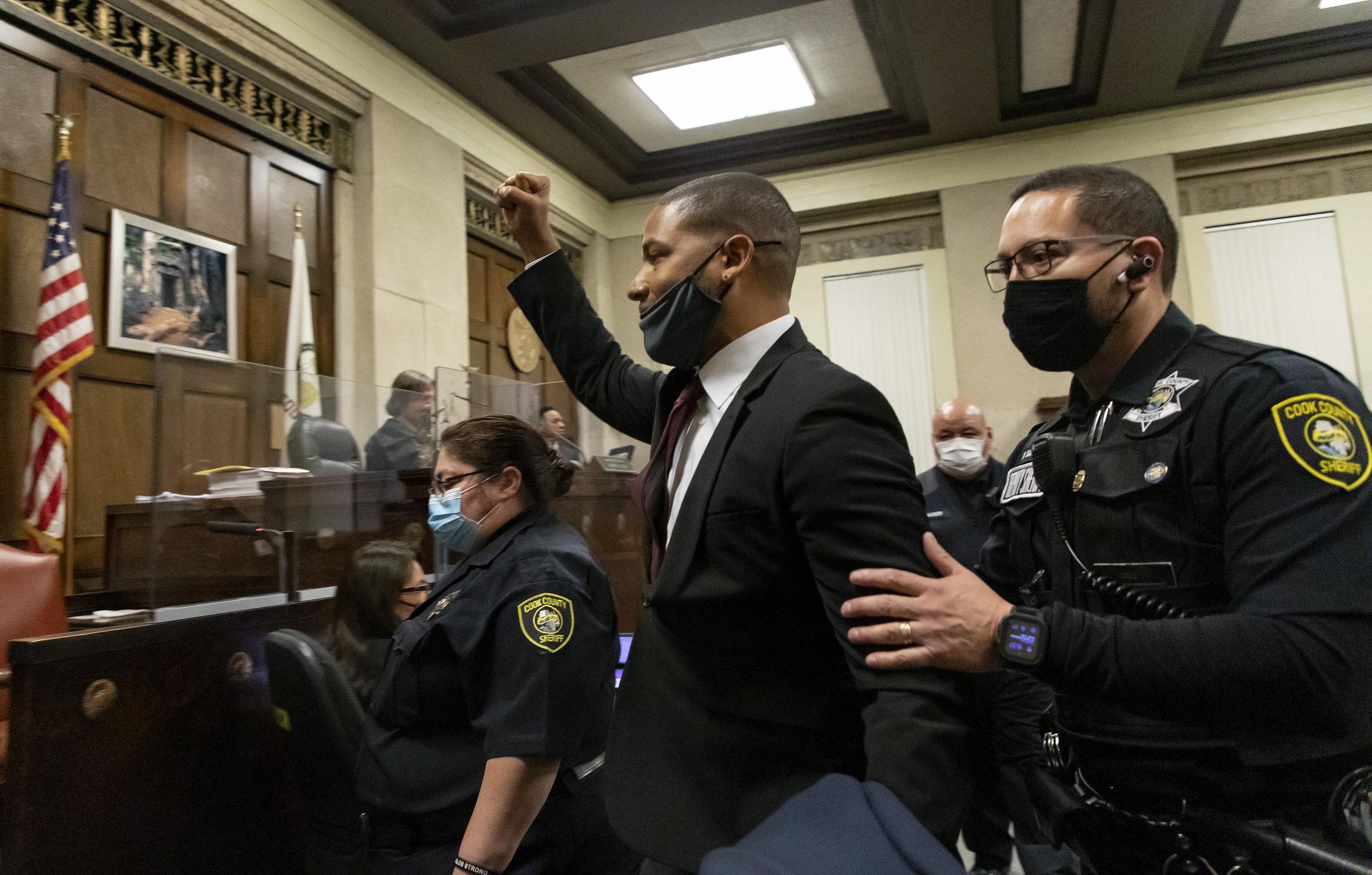 Jussie Smollett is led out of the courtroom after being sentenced at the Leighton Criminal Court Building in Chicago, Illinois on March 10, 2022. | Source: Getty Images