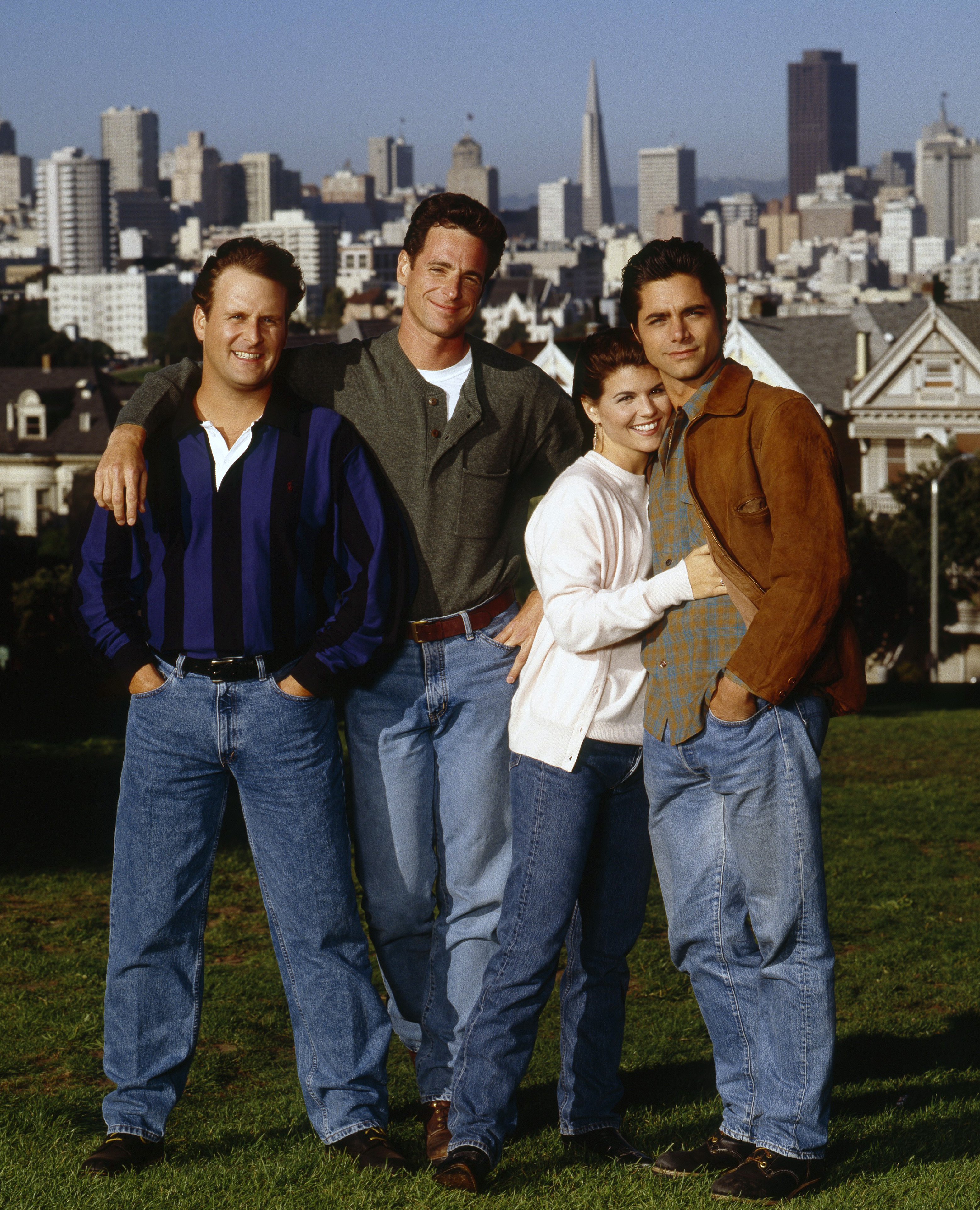 (L-R) Dave Coulier, Bob Saget, Lori Loughlin, and John Stamos pictured in a promotional photo for the ABC TV series "Full House," on August 22, 1994 | Source: Getty Images