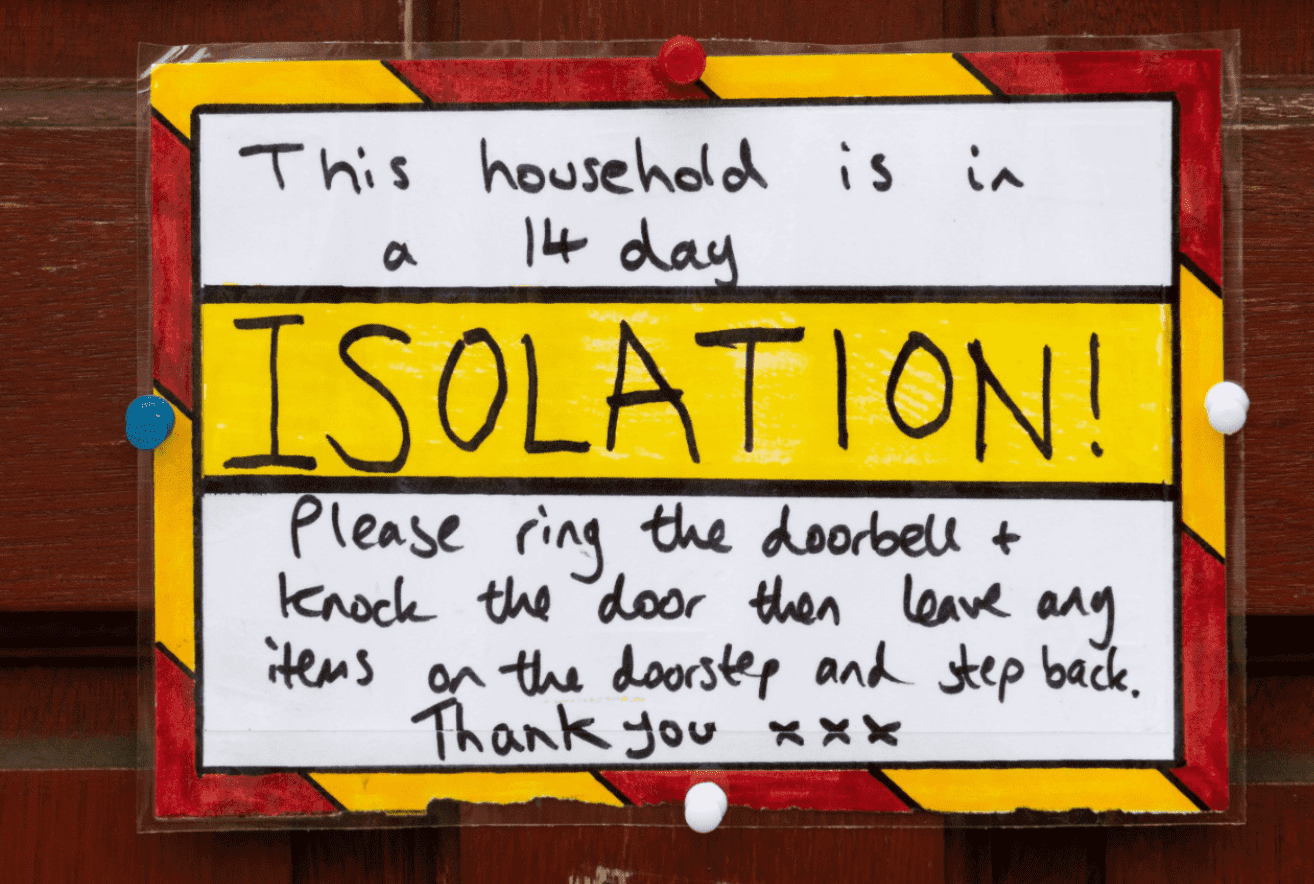  A sign on the door of a residential property where the household are in a 14 day isolation in accordance with new government guidelines on March 18, 2020 in Cardiff, United Kingdom. | Source: Getty Images