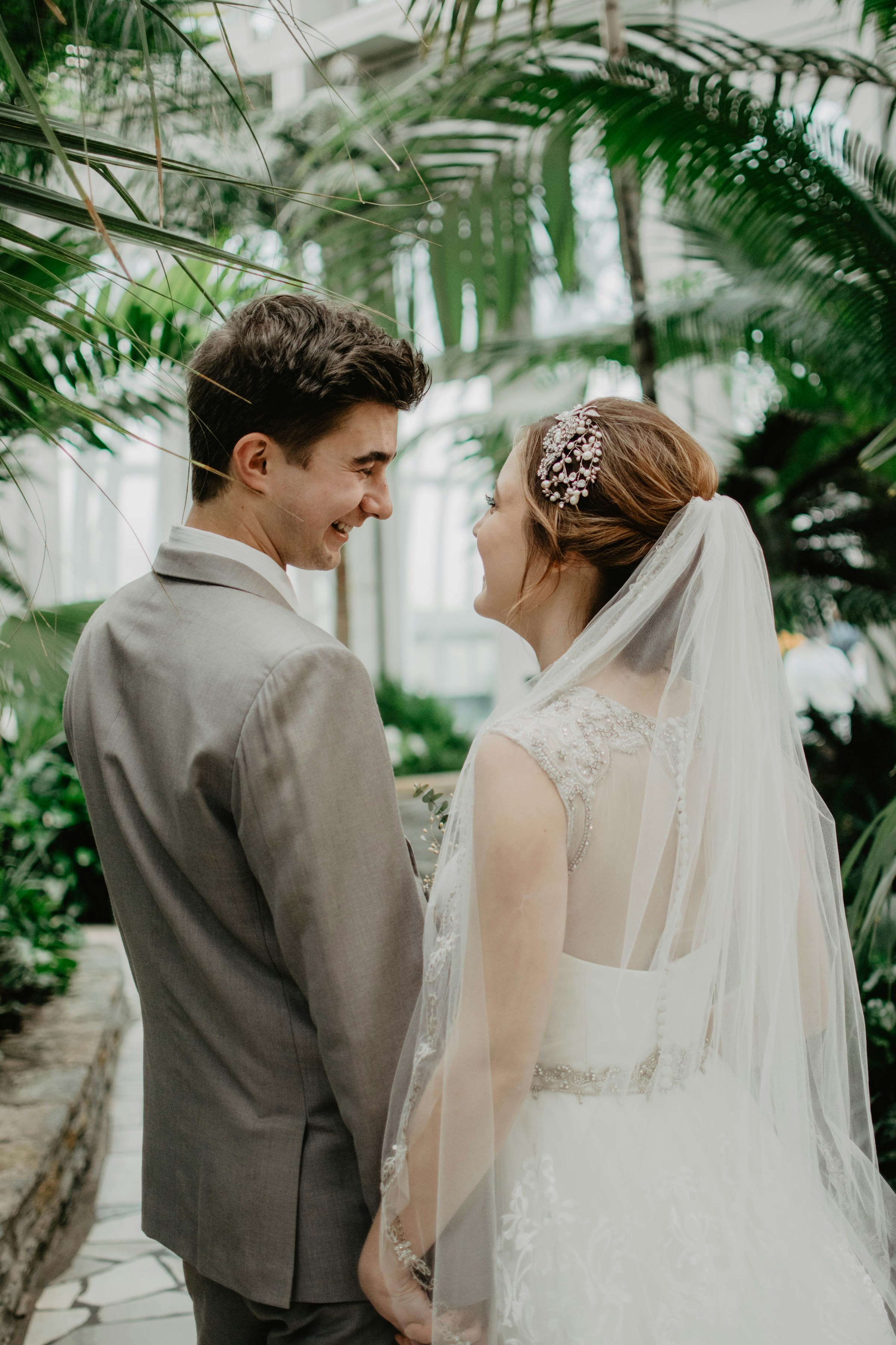 A bride and groom looking at each other and smiling | Source: Unsplash