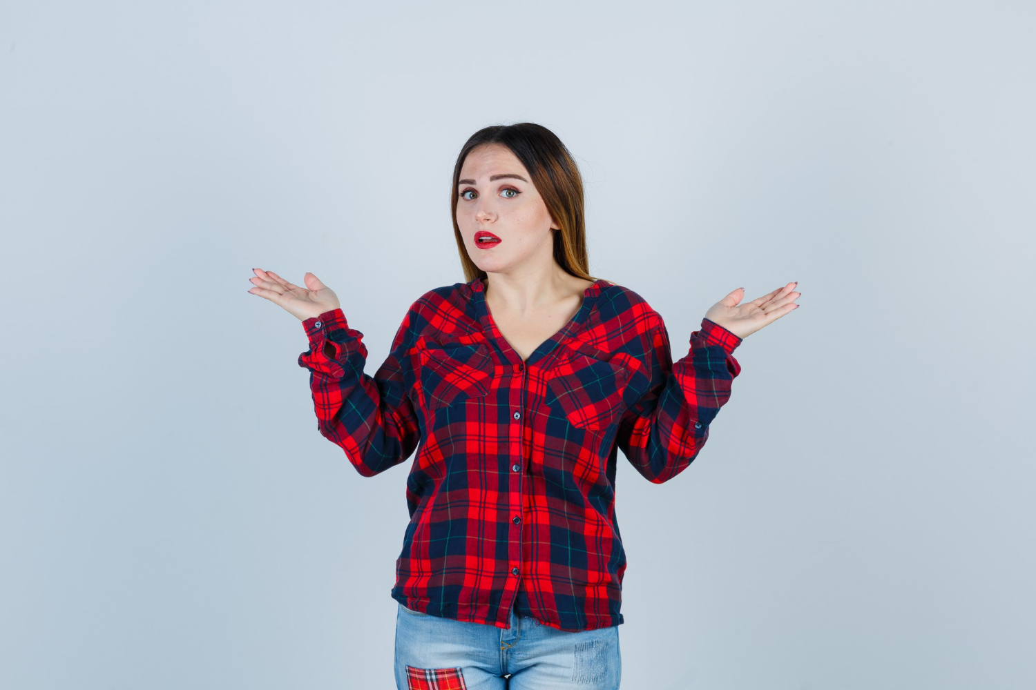 A woman shrugging | Source: Freepik