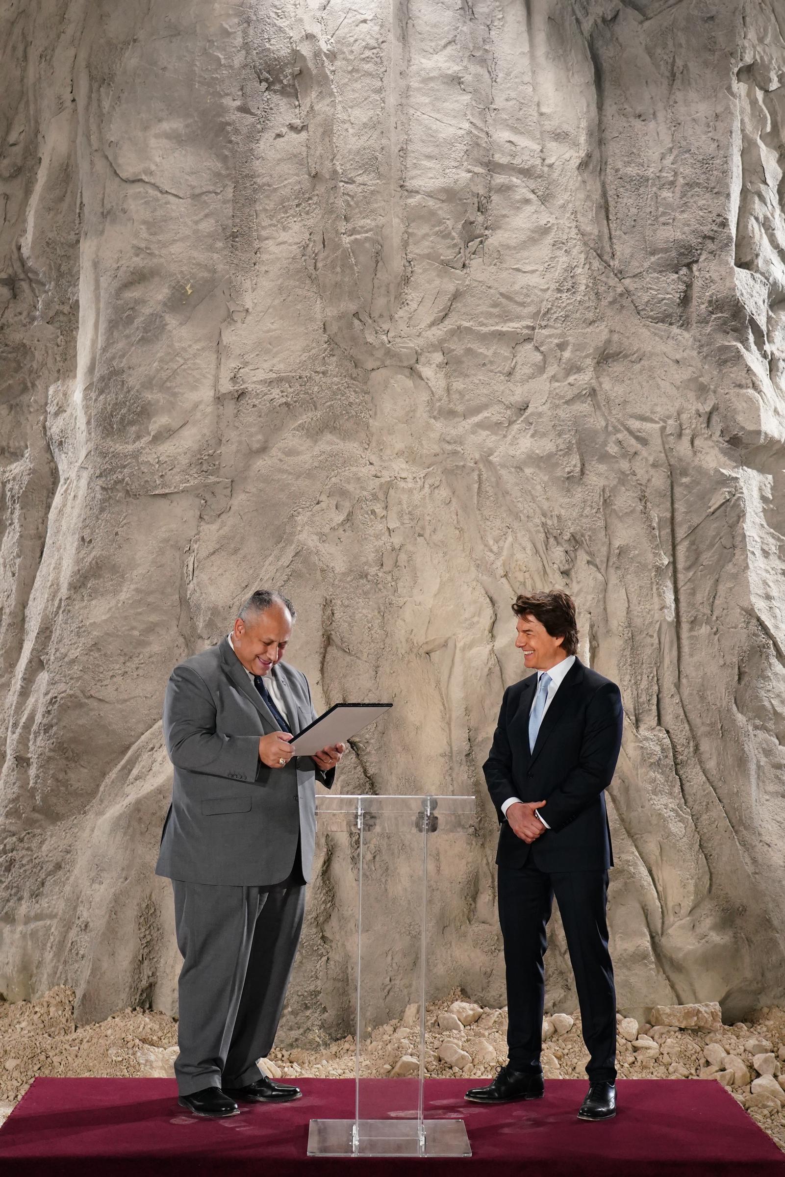 Tom Cruise and US Secretary of the Navy, Carlos Del Toro at Long Cross, UK, on December 17, 2024 | Source: Getty Images