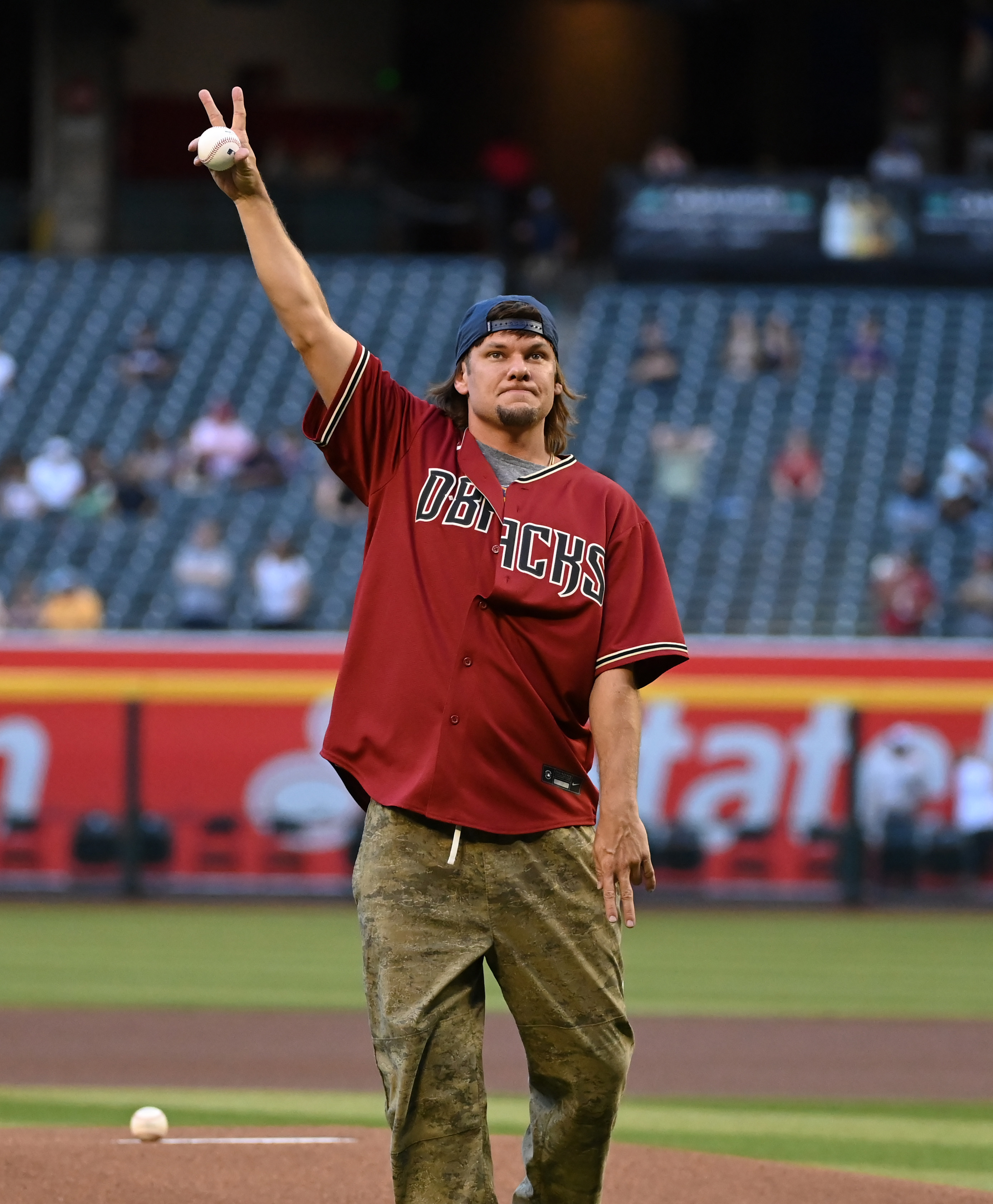 Theo Von ready to throw out the ceremonial first pitch prior to a game between the Arizona Diamondbacks and the Kansas City Royals on April 25, 2023, in Phoenix, Arizona. | Source: Getty Images