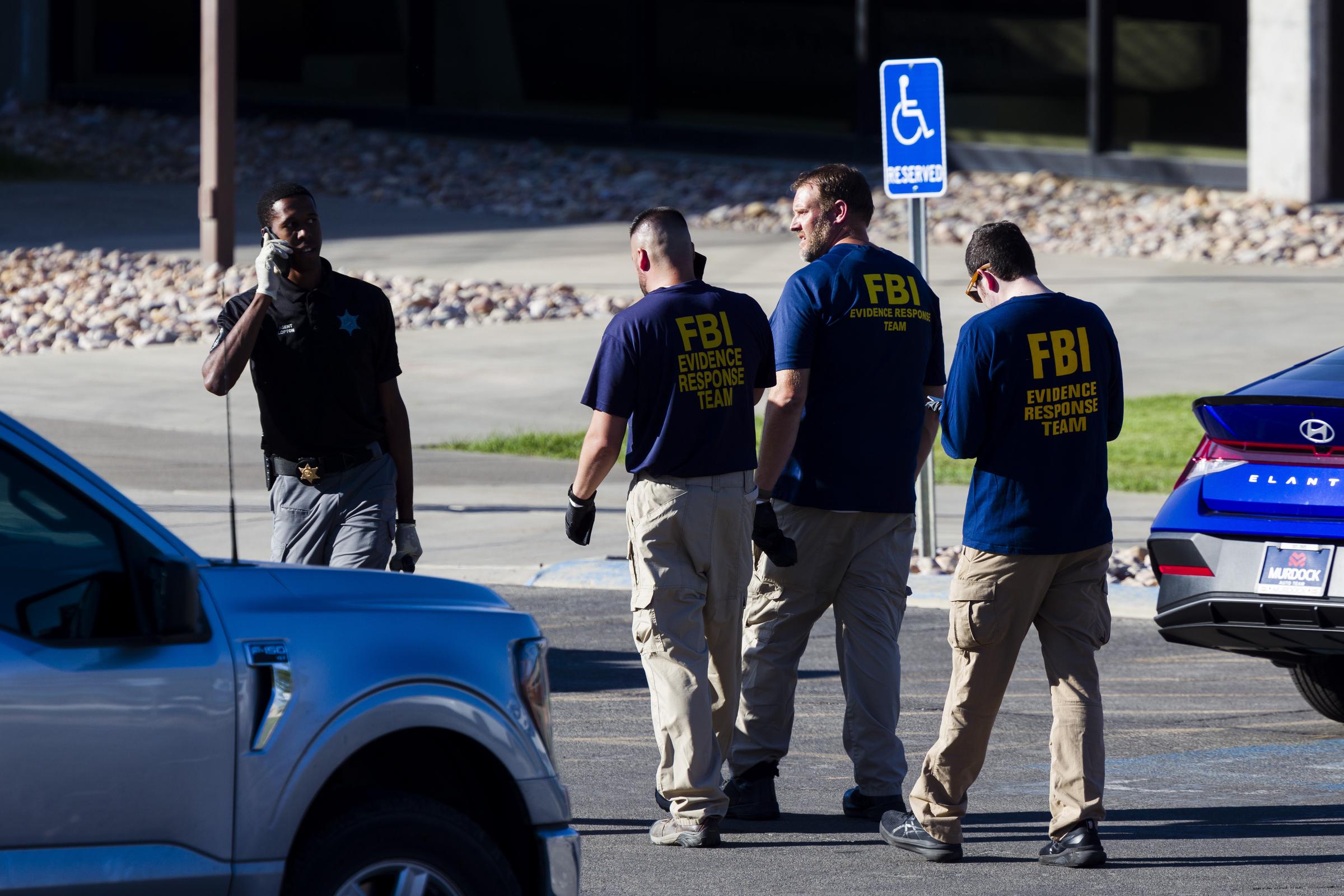 FBI agents and police officers investigate the scene at Utah Valley University on September 11, 2025, the day after Charlie Kirk was shot and killed | Source: Getty Images