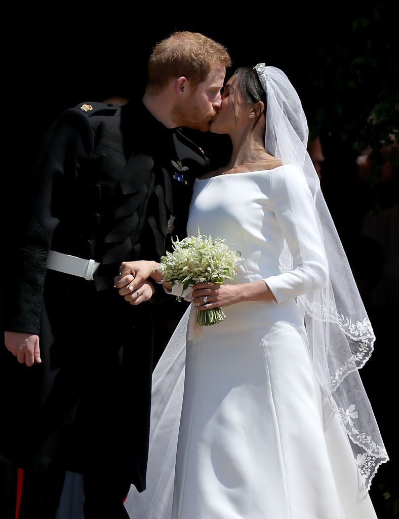 Prince Harry and Duchess Meghan share a kiss after their wedding at St George's Chapel on May 19, 2018, in Windsor, England | Photo: Jane Barlow - WPA Pool/Getty Images