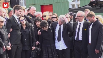 Family members and close friends gathered in a show of unity, standing shoulder to shoulder as they honoured Moya Brennan's life and legacy. | Source: Instagram/irishmirror