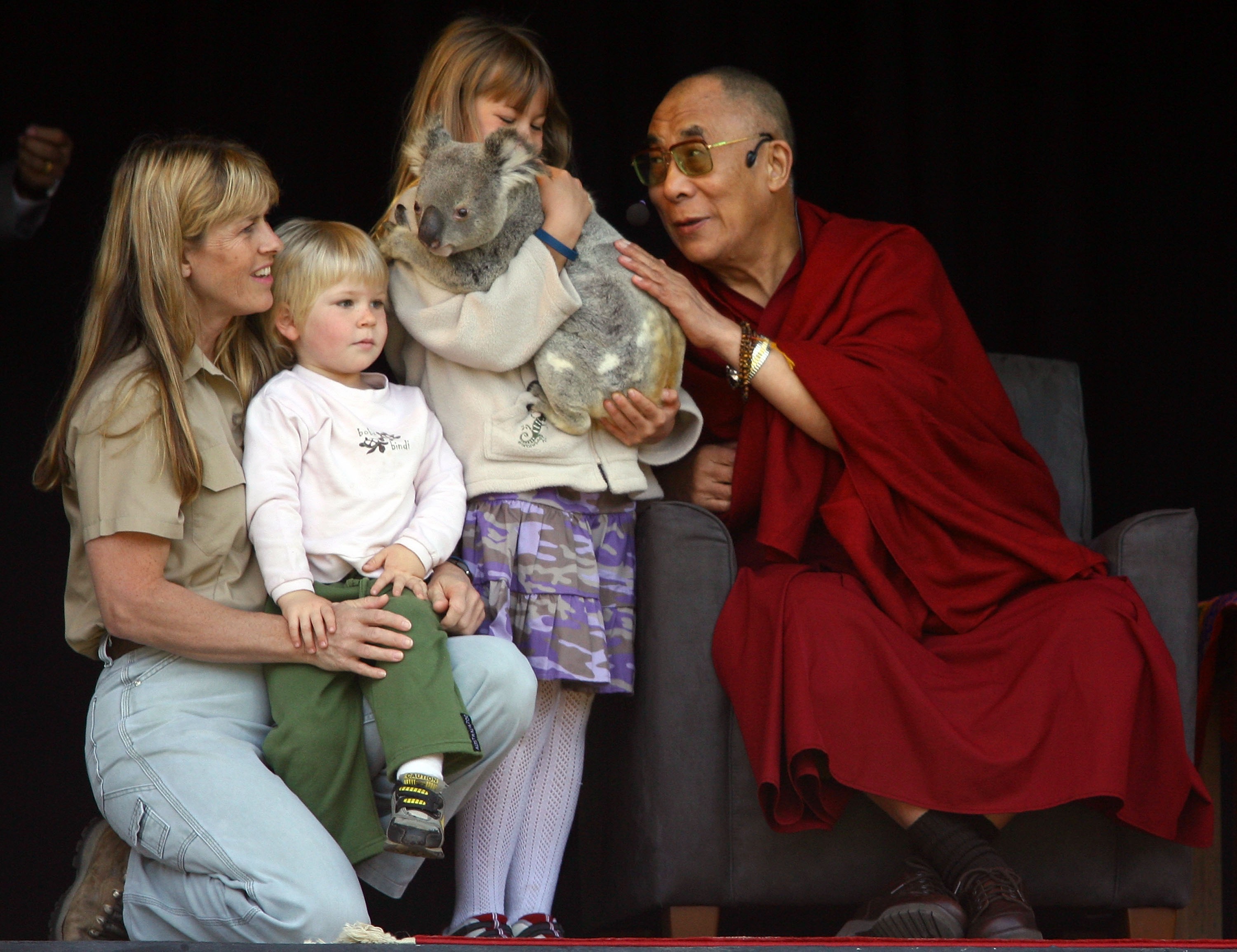 Terri, Bindi, and Robert Irwin with the Dalai Lama, as Bindi holds a Koala, at the Australia Zoo in Beerwah, Australia on June 13, 2007. | Source: Getty Images