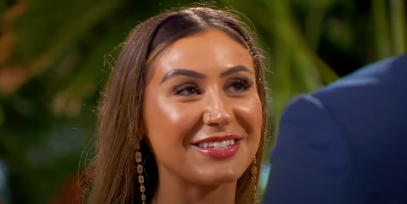 Juliana Pasquarosa sweetly smiling at Grant Ellis on "The Bachelor" season 29 finale posted on March 25, 2025 | Source: YouTube/thebachelornationn