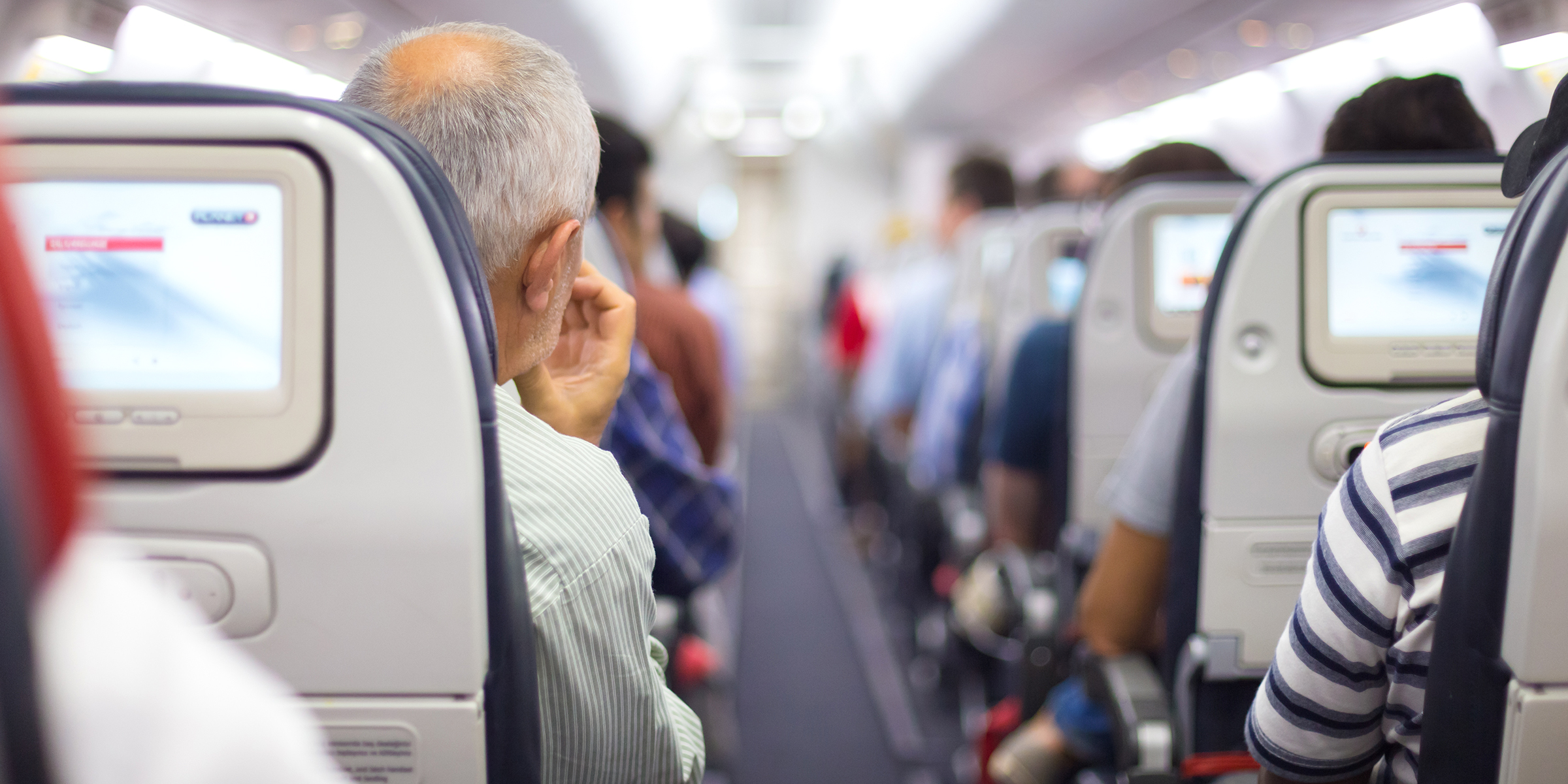 Passengers in an airplane | Source: Shutterstock