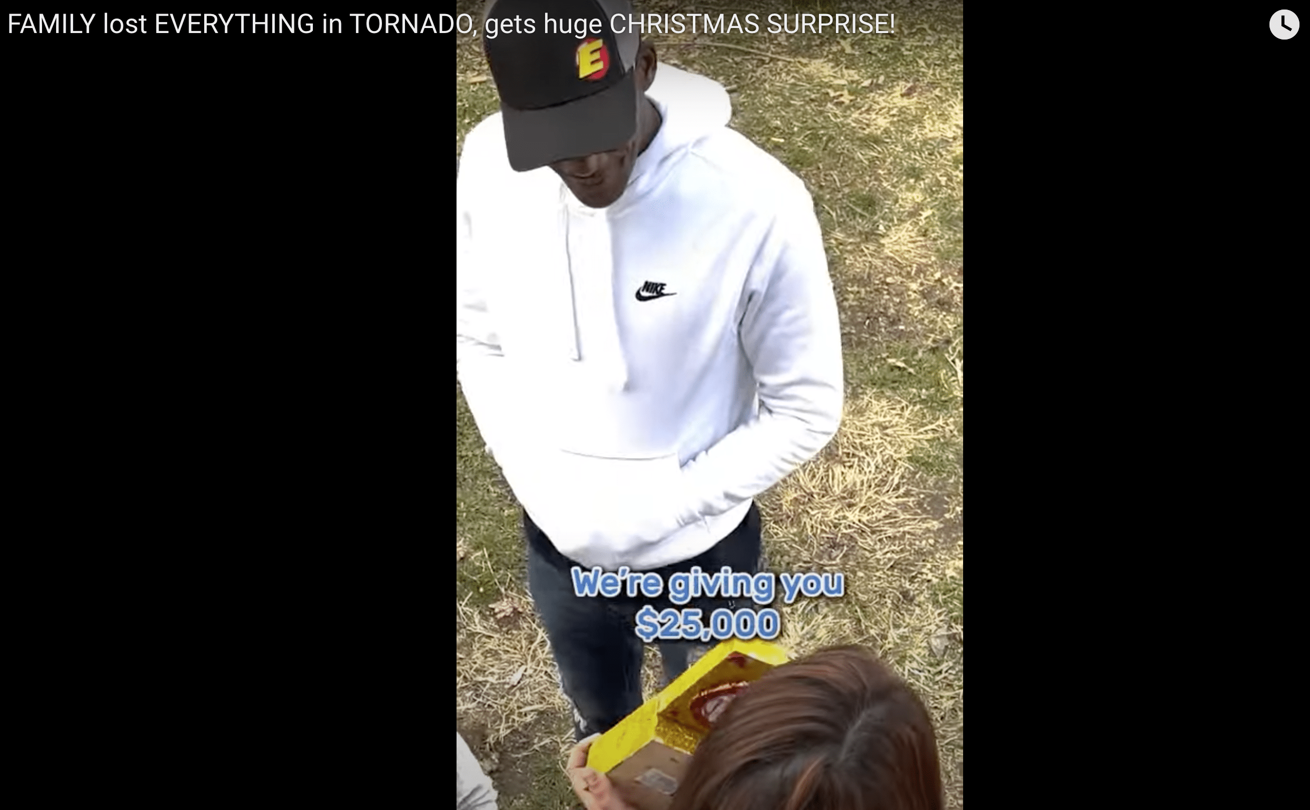 The woman receiving their first gift. | Source: Youtube.com/CharlieRocket