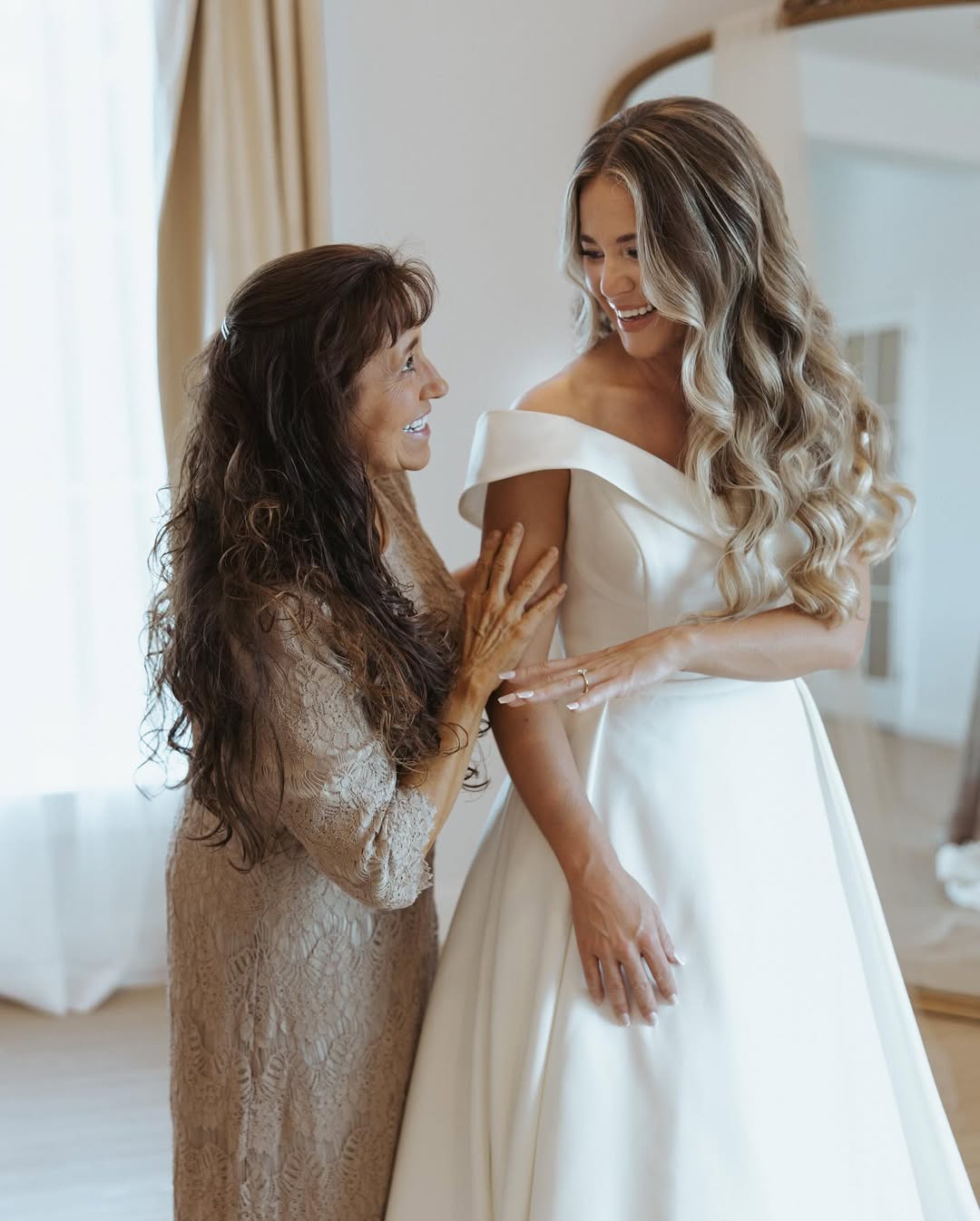 Jana Duggar beams as she shows her ring, sharing a joyful moment with her mother, Michelle Duggar, before the ceremony. | Source: Instagram/janamduggar