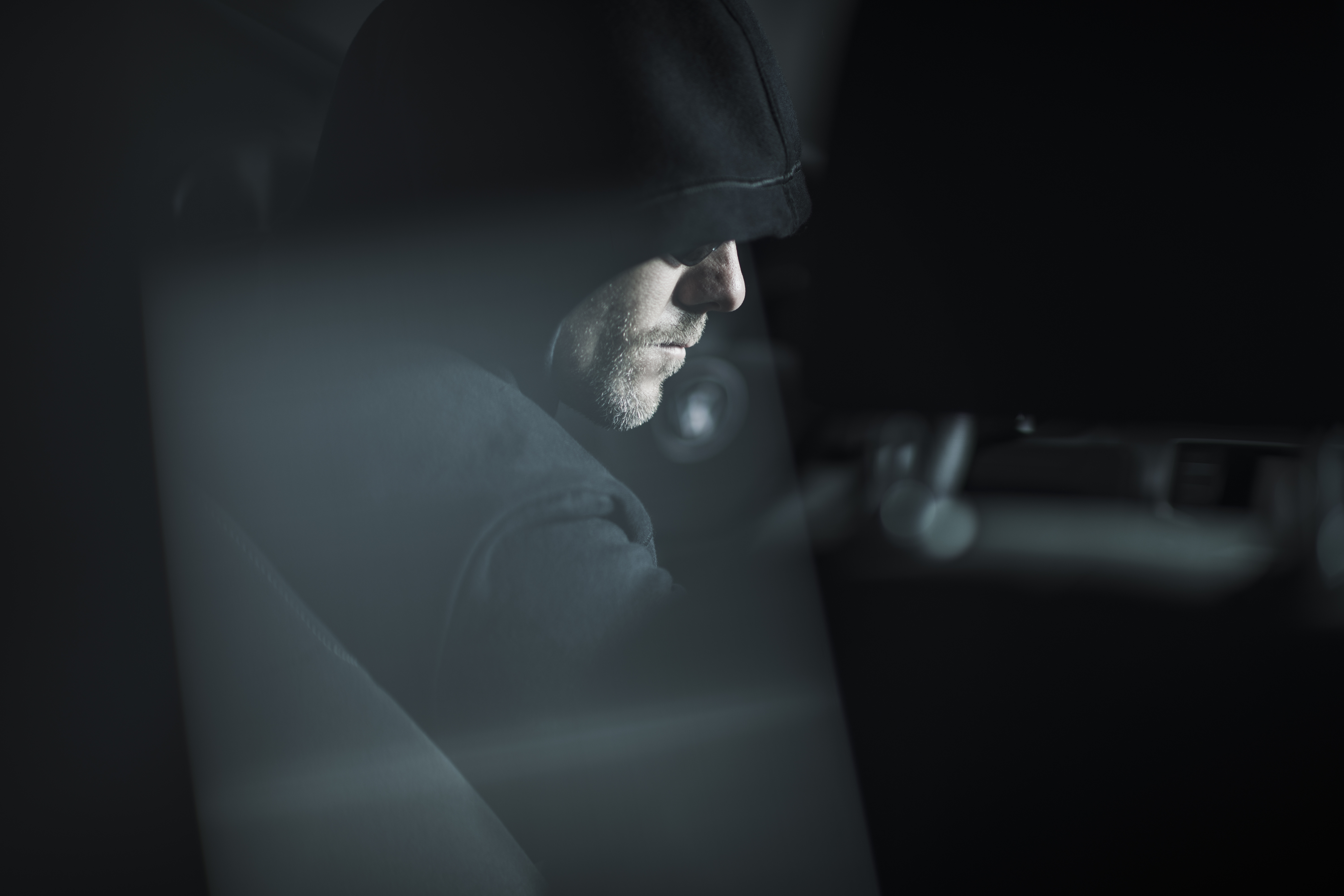 Robber in Black Hood. | Source: Shutterstock