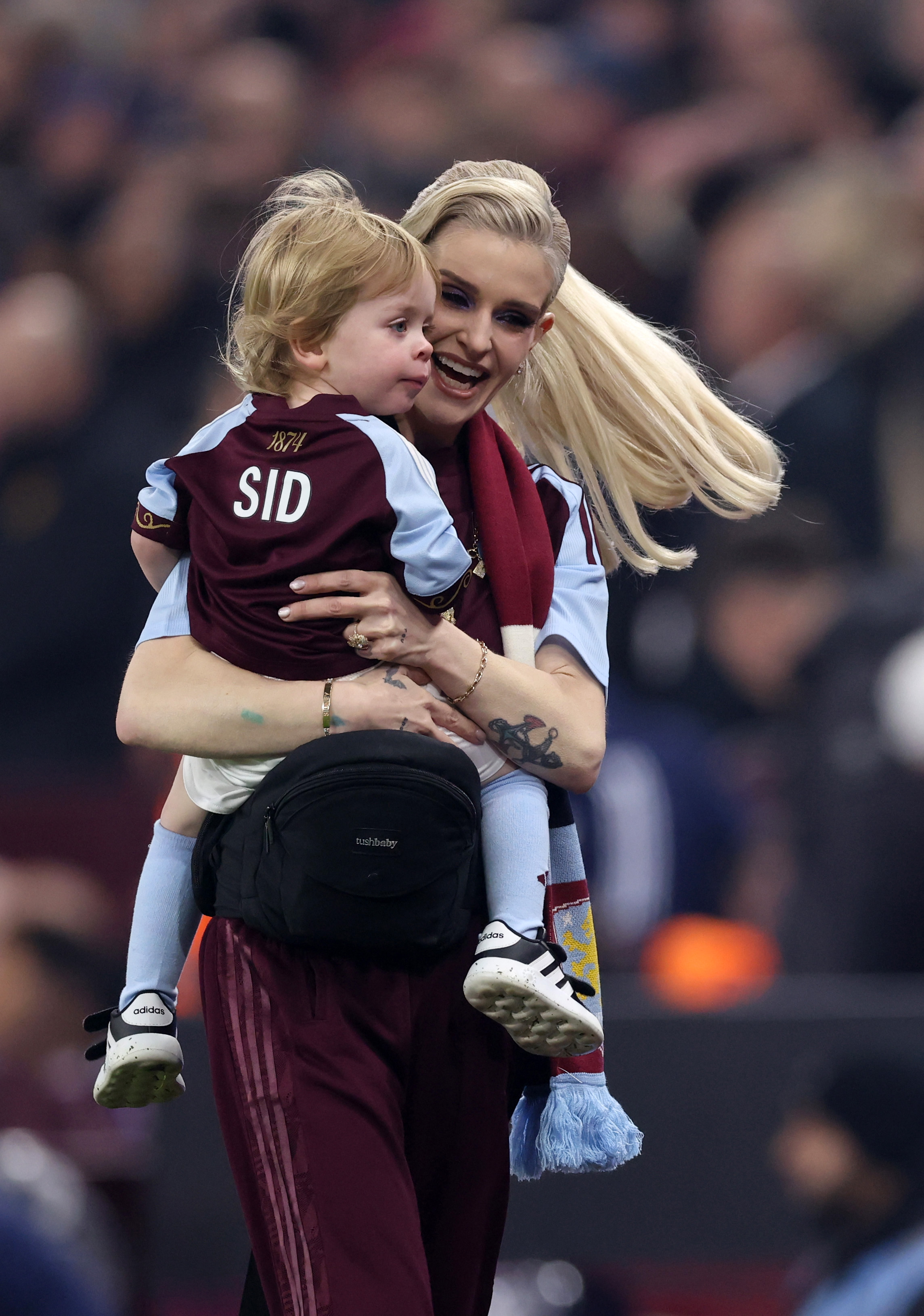Kelly Osbourne and son Sidney are pictured ahead of the Premier League match between Aston Villa and Manchester United at Villa Park on 21 December 2025 in Birmingham, England. | Source: Getty Images