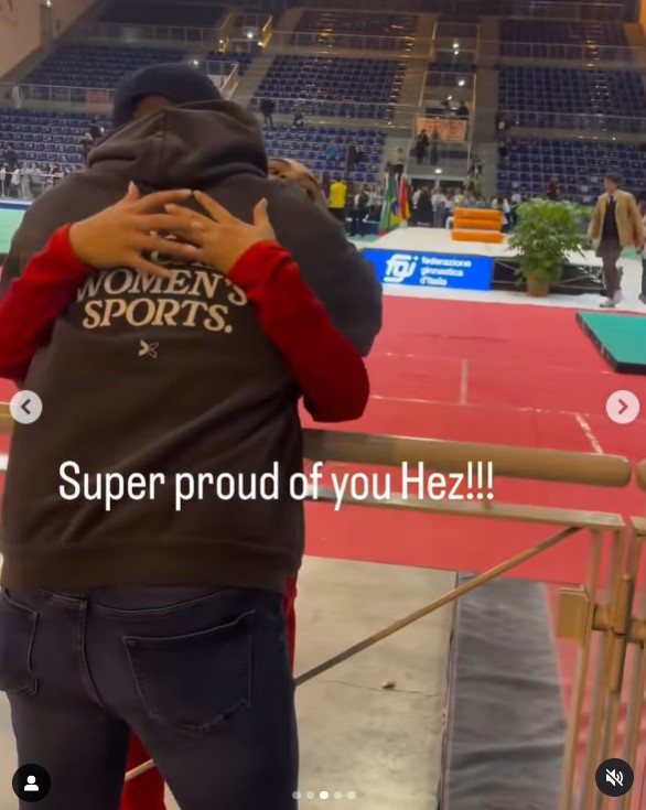 Hezly "Hez" Rivera getting a hug from Henry Rivera at the Paris Olympics in a social media post uploaded on July 2, 2024 | Source: Instagram/togethxr