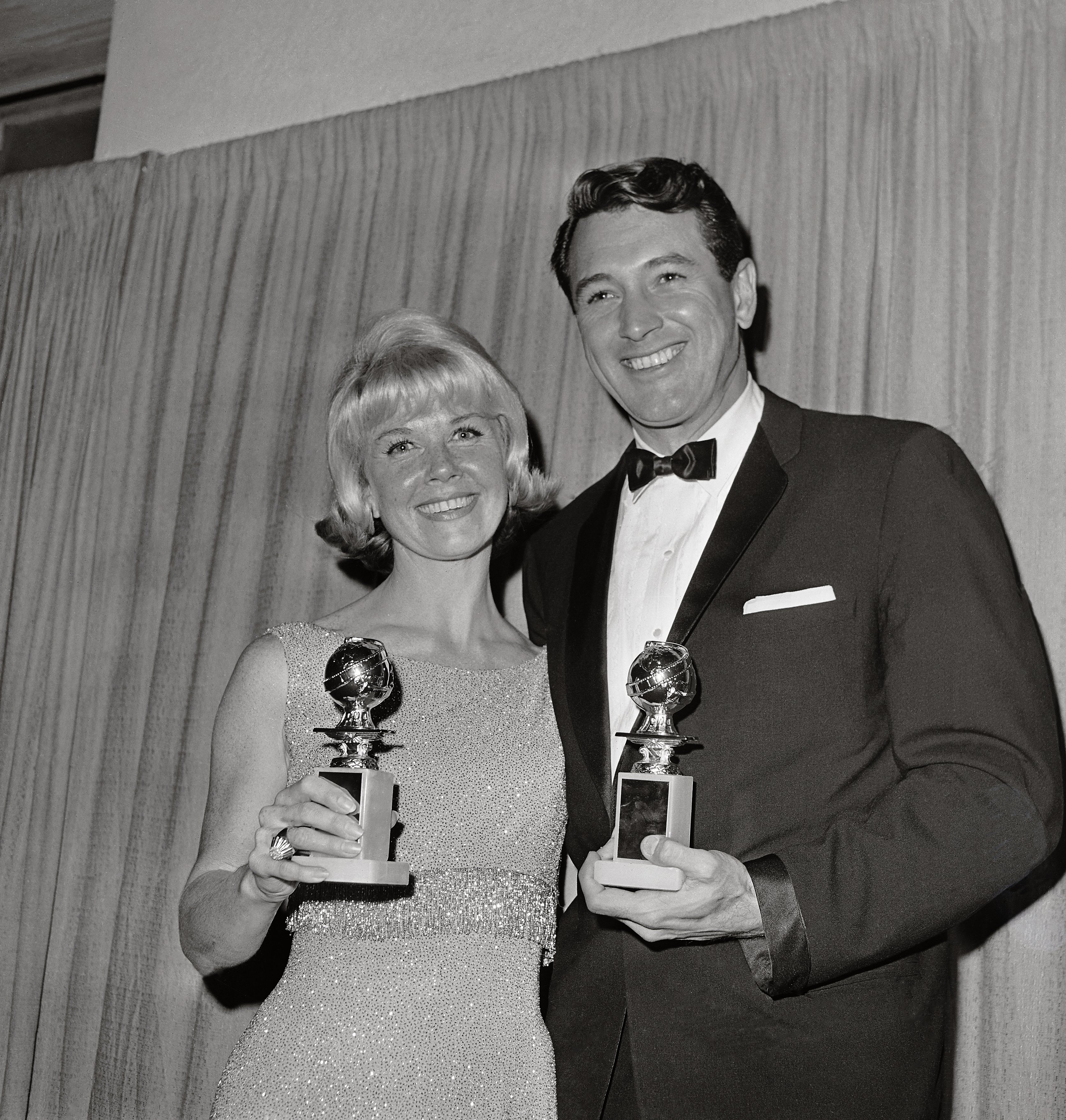 Rock Hudson and Doris Day pose for a picture after winning the Golden Globes | Source: Getty Images
