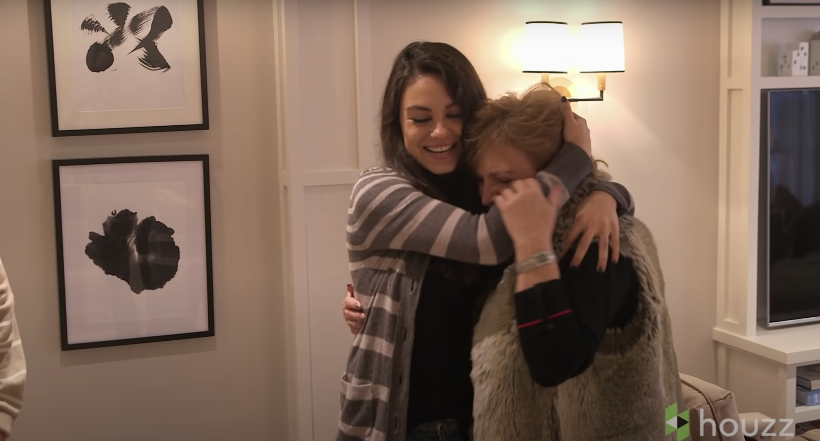 Mila Kunis hugs her mom, Elvira Kunis | Source: Youtube.com/HouzzTV