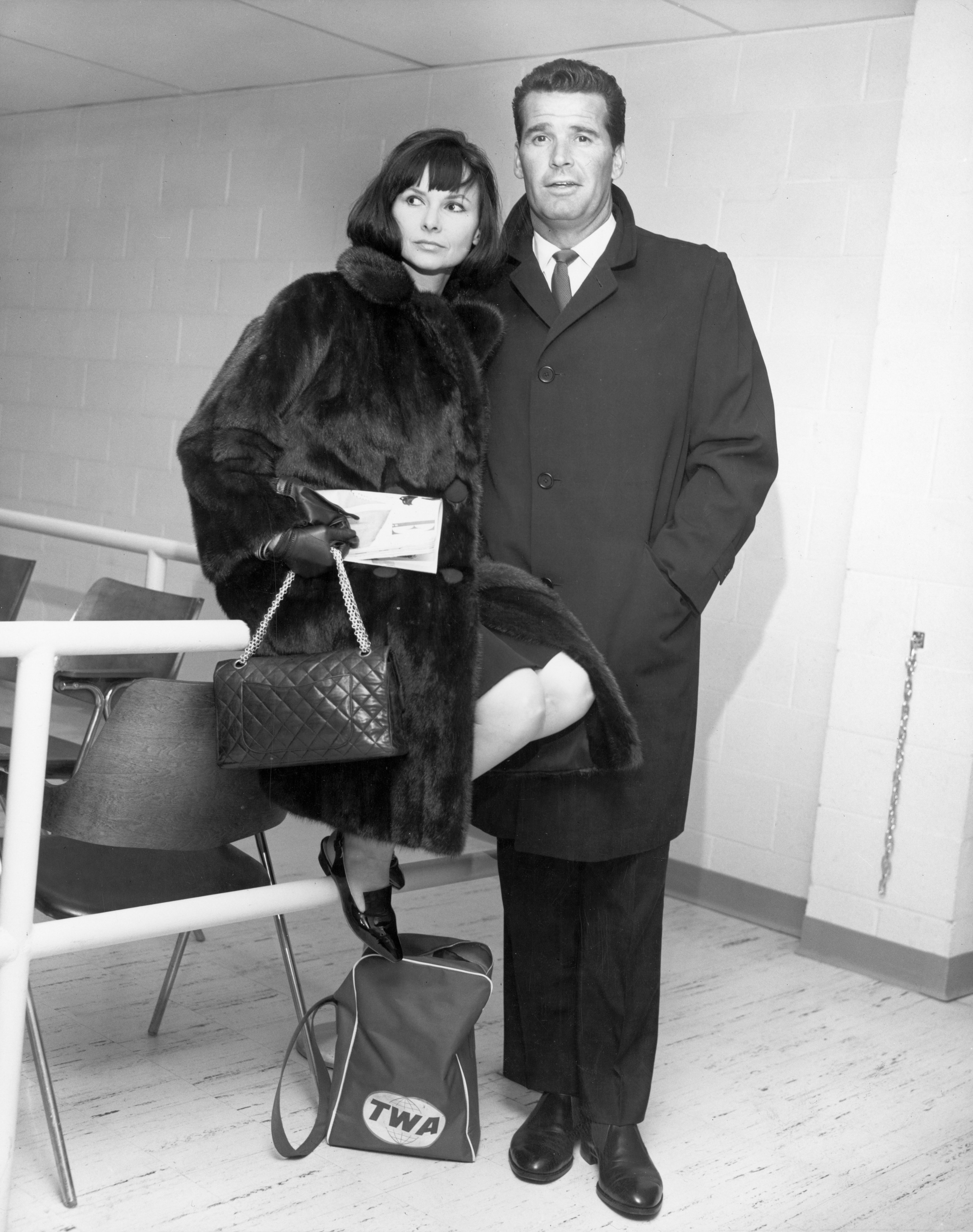 James Garner and his wife, Lois Clarke, inside John F Kennedy airport before boarding a flight to England from New York City. | Source: Getty Images