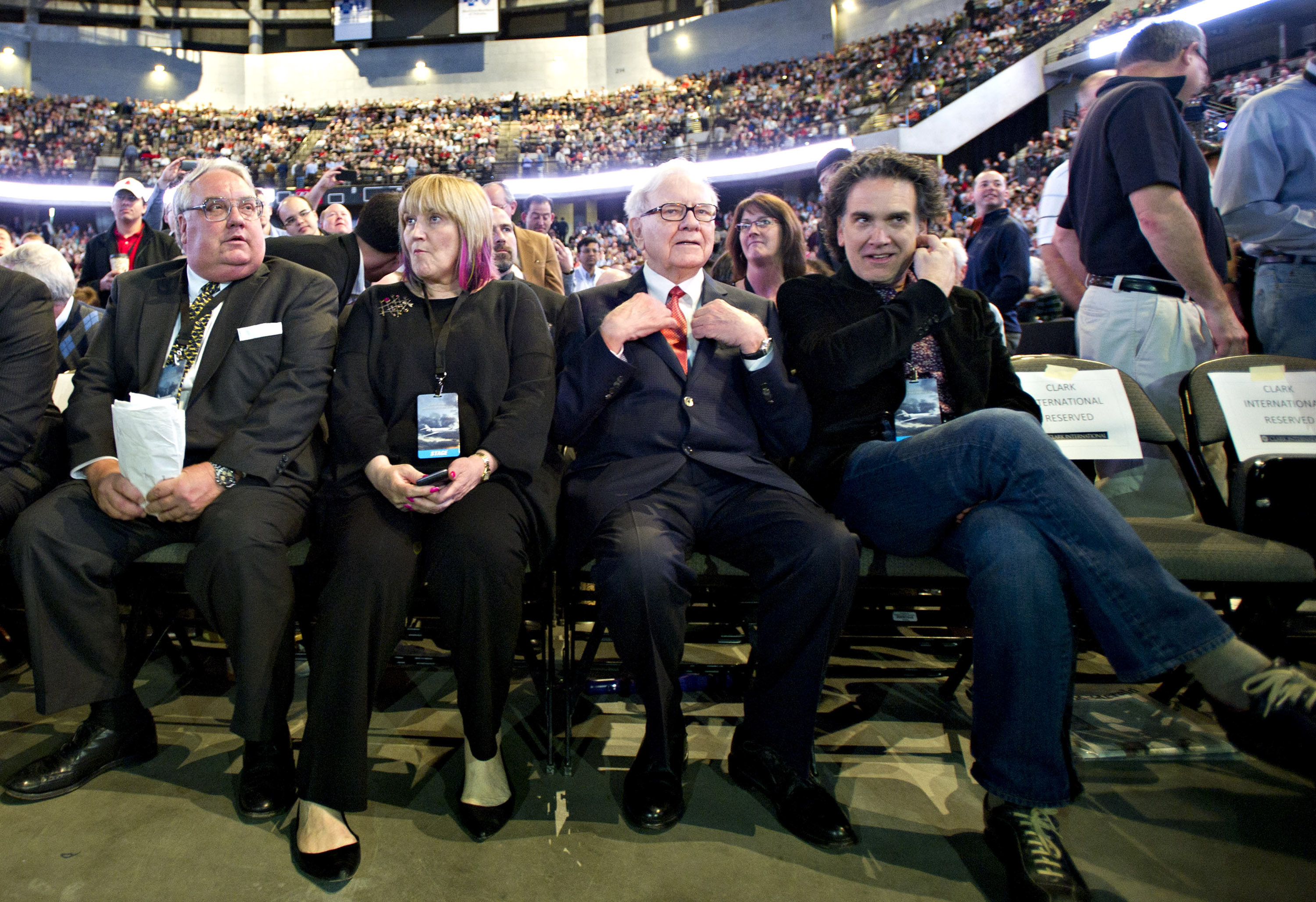 Howard, Susie, Warren, and Peter Buffett on the floor of the Berkshire Hathaway shareholders meeting at the Qwest Center in Omaha, Nebraska, on April 30, 2011. | Source: Getty Images