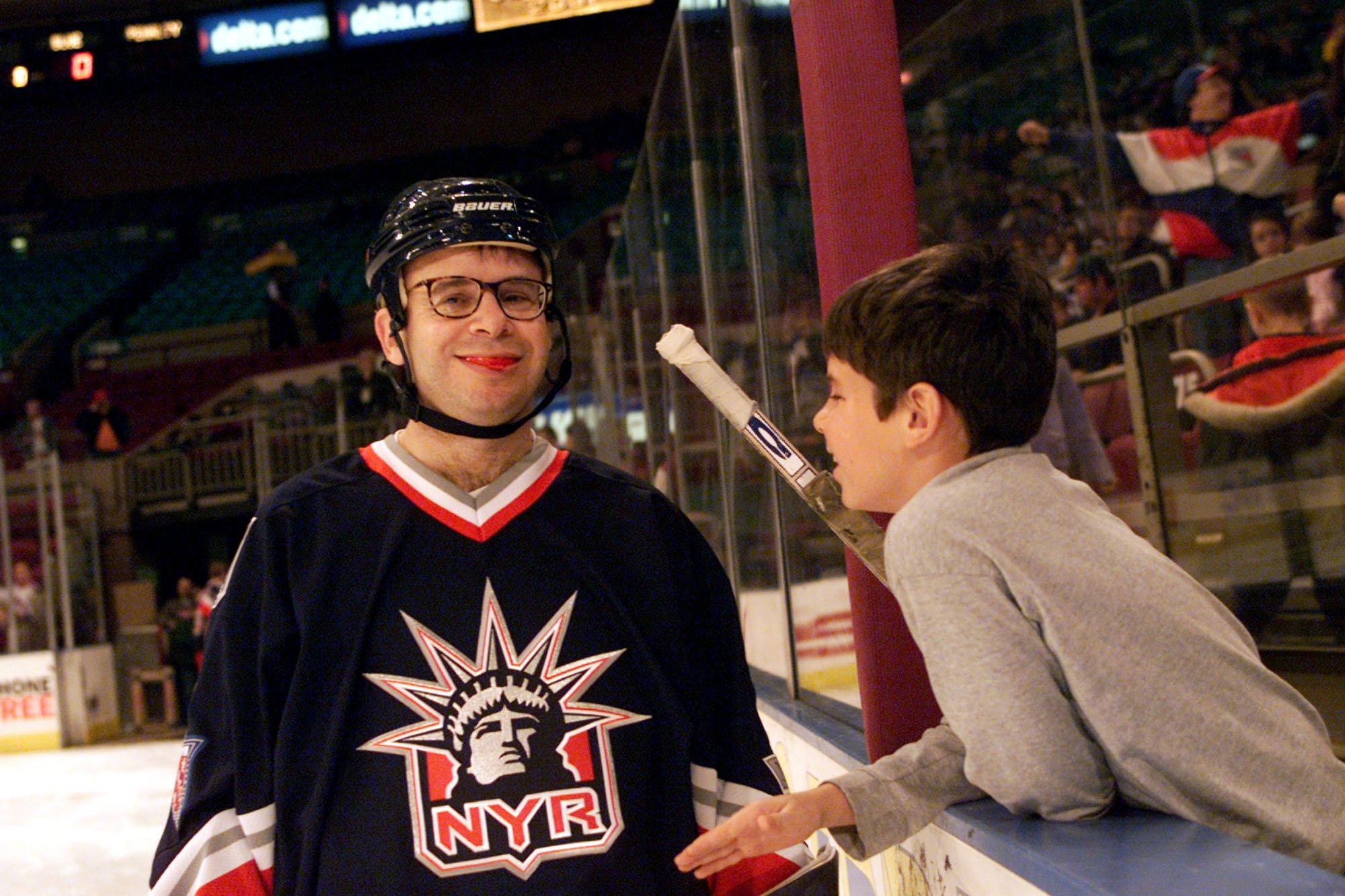 Comedian Rick Moranis pictured with his son Mitchell at the Superskate 2001 charity hockey event at Madison Square Garden on January 7, 2001 in New York City. | Source: Getty Images