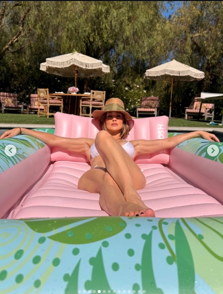Jennifer Lopez relaxed by the pool at her Hidden Hills home in a post shared on May 26, 2026. | Source: Instagram/jlo