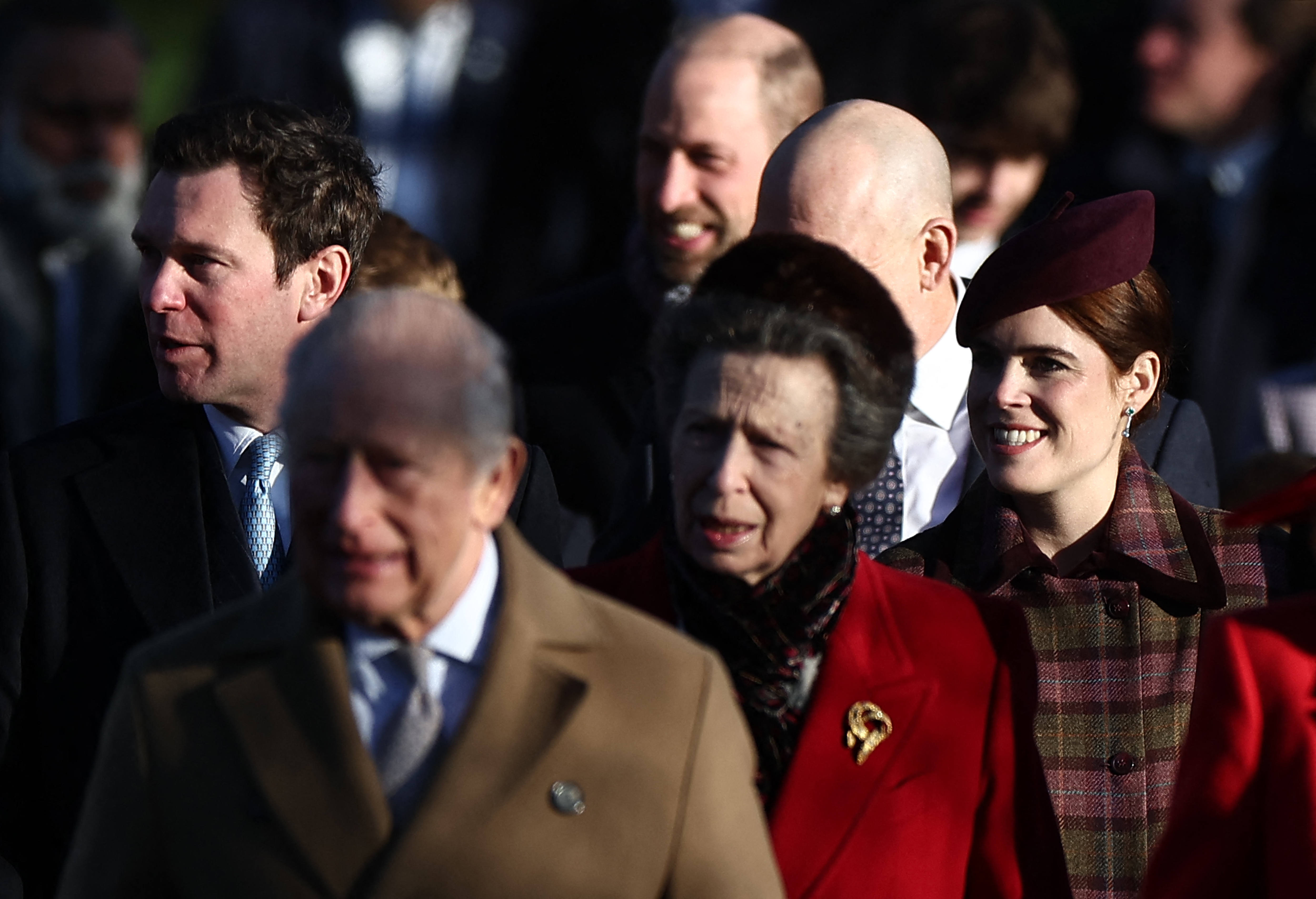 King Charles III leads senior royals away from St Mary Magdalene Church after the Christmas Day service on the Sandringham Estate, joined by Anne, Princess Royal, Queen Camilla, and Princess Eugenie. The annual walk remains one of the most public displays of royal togetherness during the festive period.
