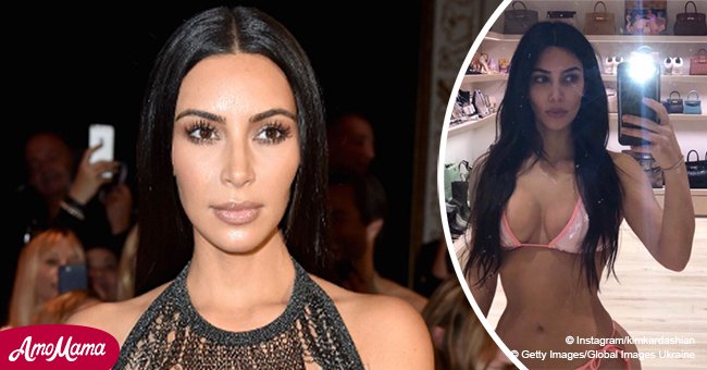 Kim Kardashian flaunts hourglass curves in barely-there pink bikini sparkling under the light