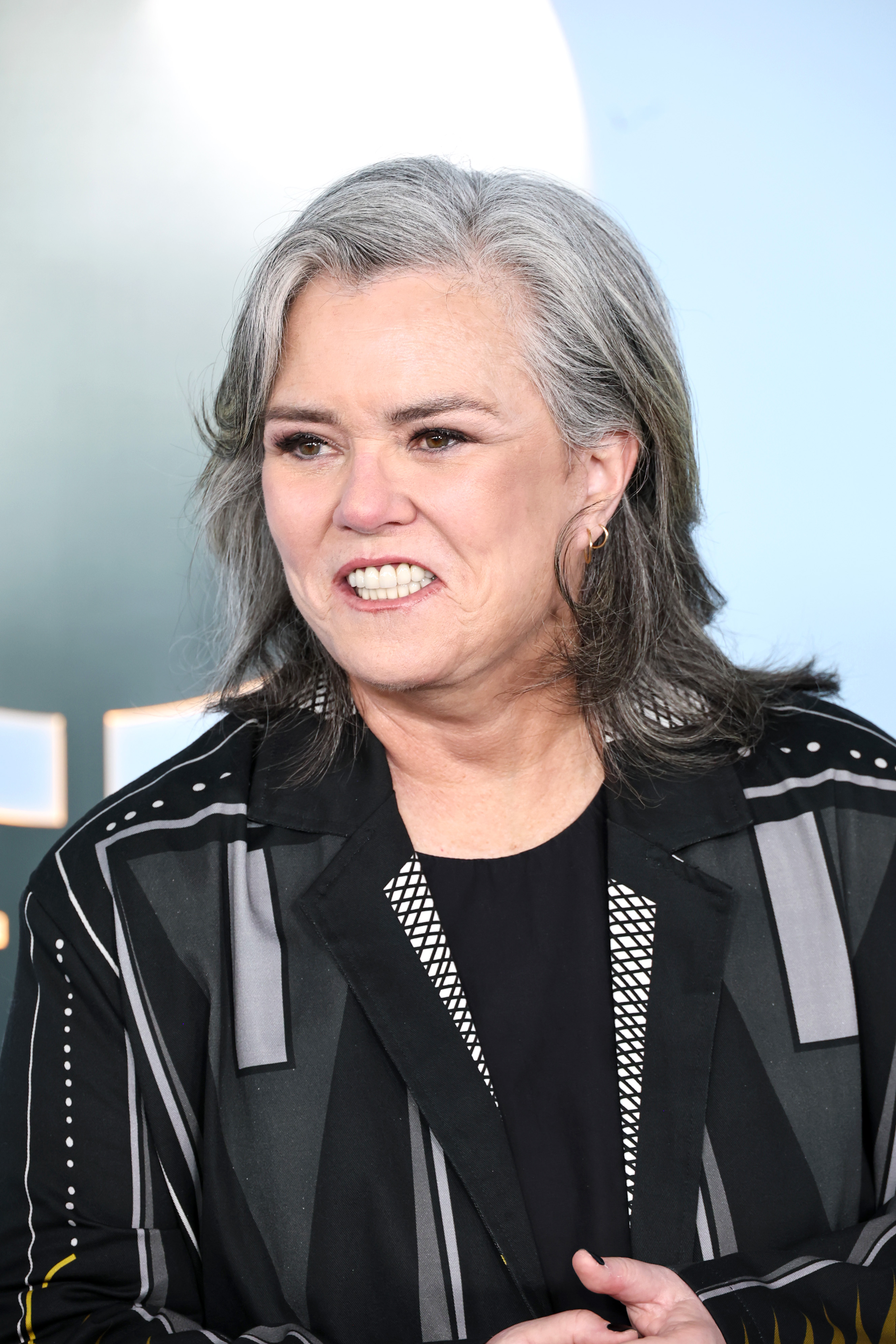 Rosie O'Donnell turns slightly to the side during a candid moment on the carpet. Different angles prompted viewers to compare the images with her previous public appearances.