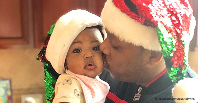 Mike Bivins melts hearts while doting on baby daughter as they wear matching Santa hats in pic