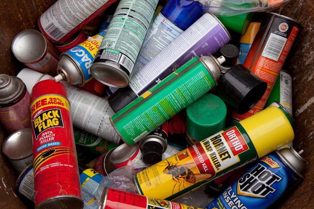 A load of bug spray aerosols lying in a heap | Shutterstock