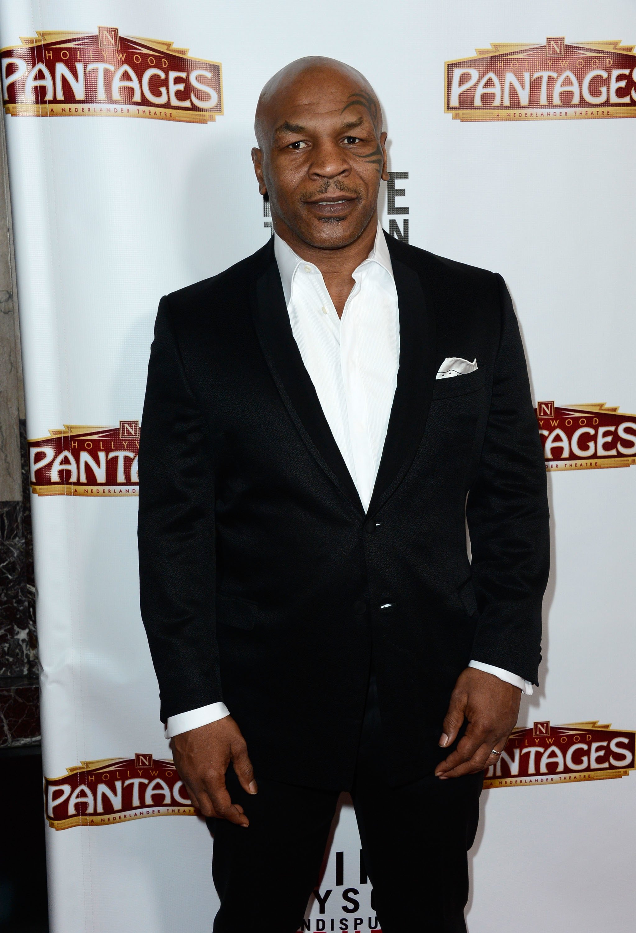 Mike Tyson arrives at the Pantages Theatre on March 8, 2013 in Hollywood, California | Photo: Getty Images