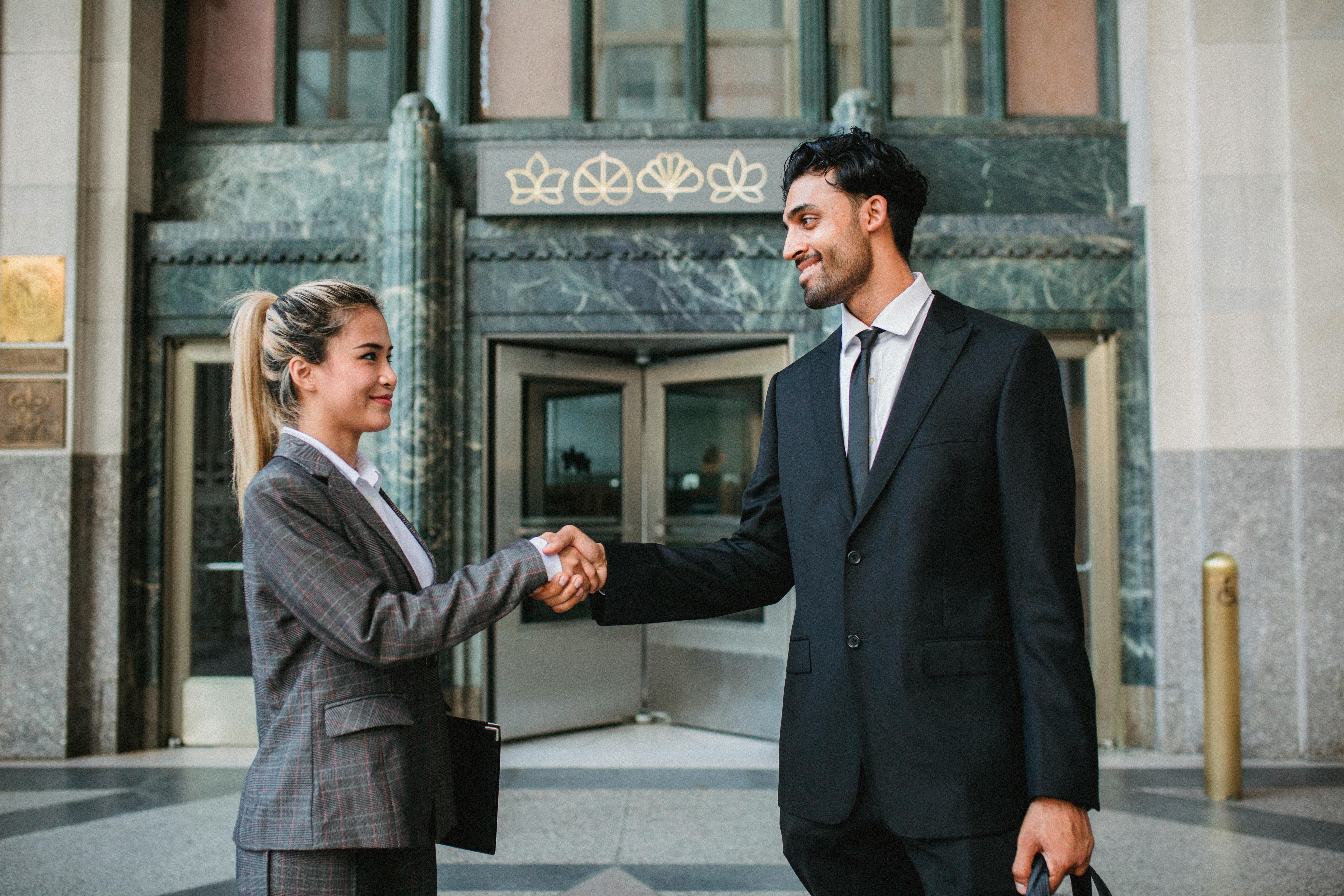 A businessman shaking a colleague's hand | Source: Pexels