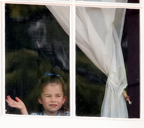 Princess Charlotte looks out the window of Buckingham Palace at Trooping the Color in June 2019 | Photo: Getty Images