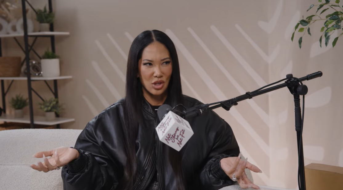 Kimora Lee Simmons reacts during her appearance on the "Not Skinny But Not Fat" podcast, where she opened up about her daughter Aoki's brief relationship | Source: YouTube/notskinnybutnotfat