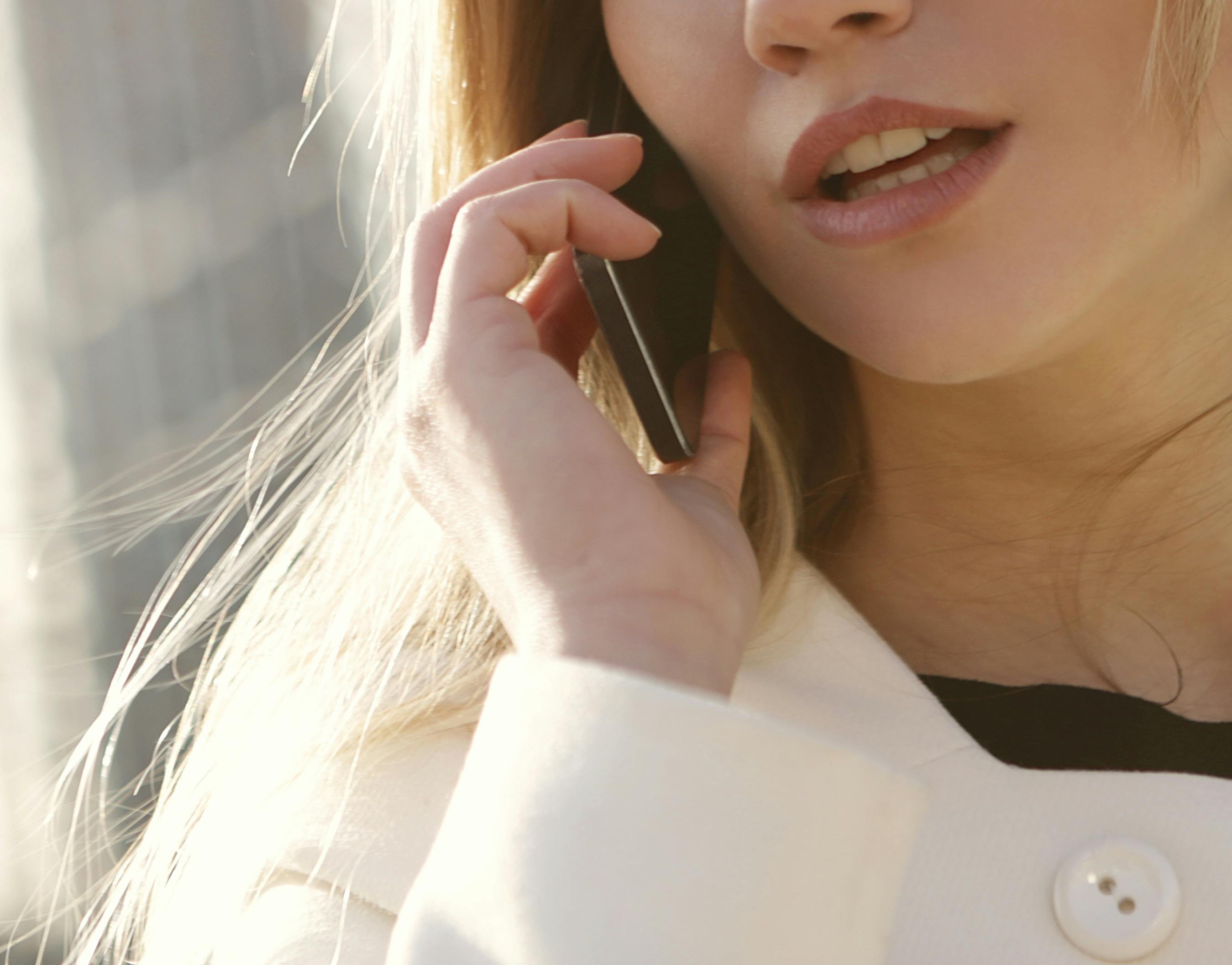 Close-up of a young woman on a phone call | Source: Pexels