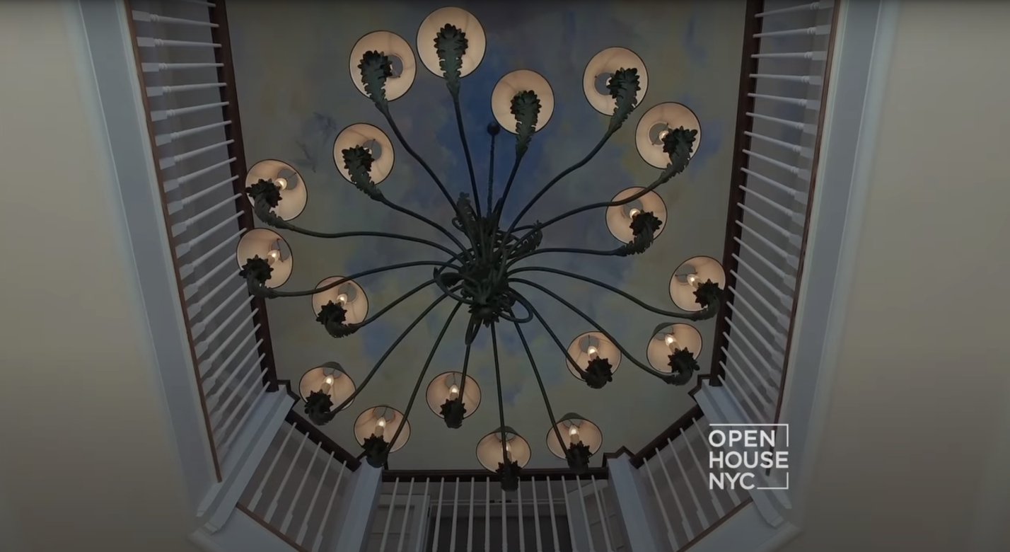 A sweet painting with a magnificent chandelier. | Source: Youtube.com/Open House TV
