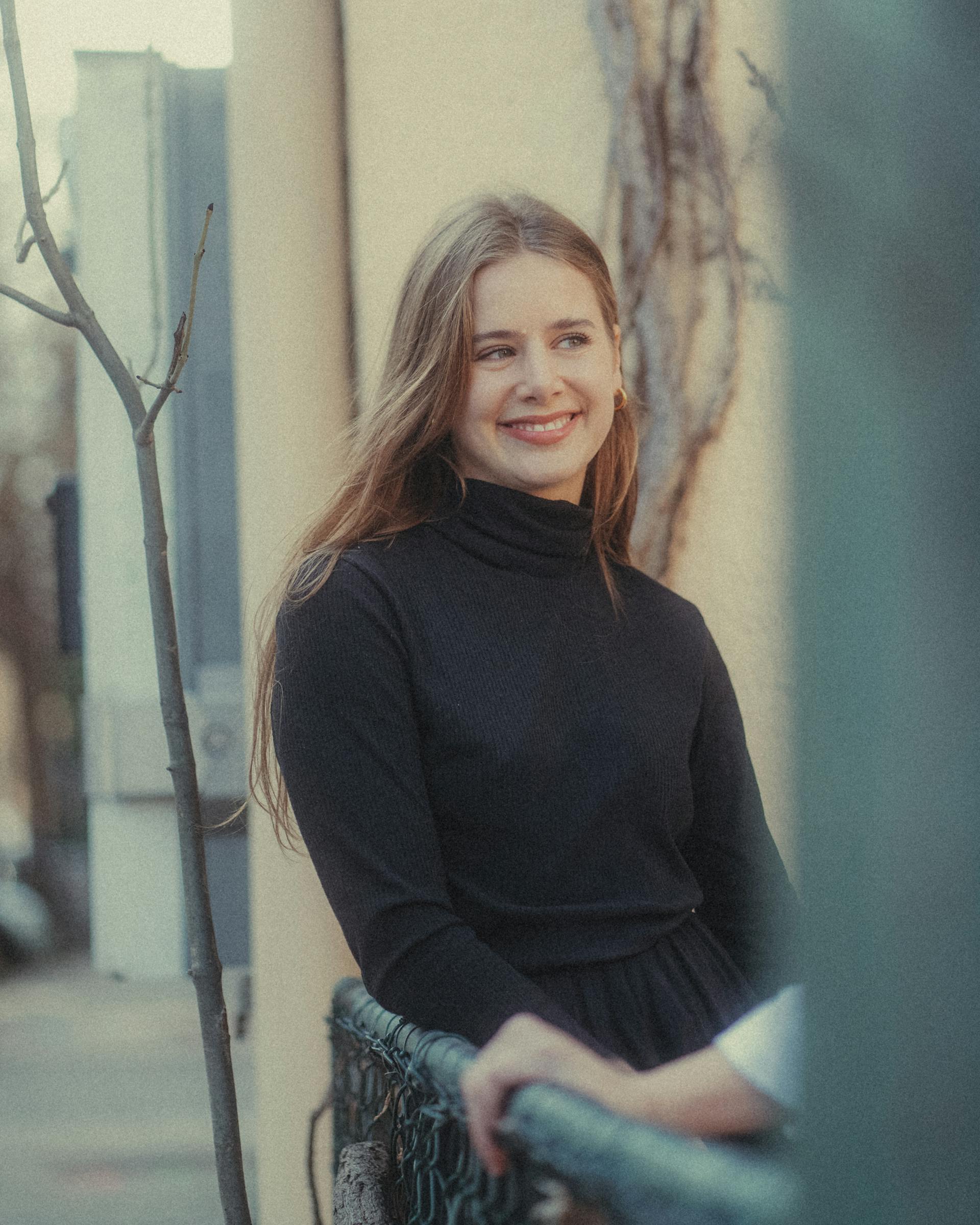 A young woman smiling | Source: Pexels