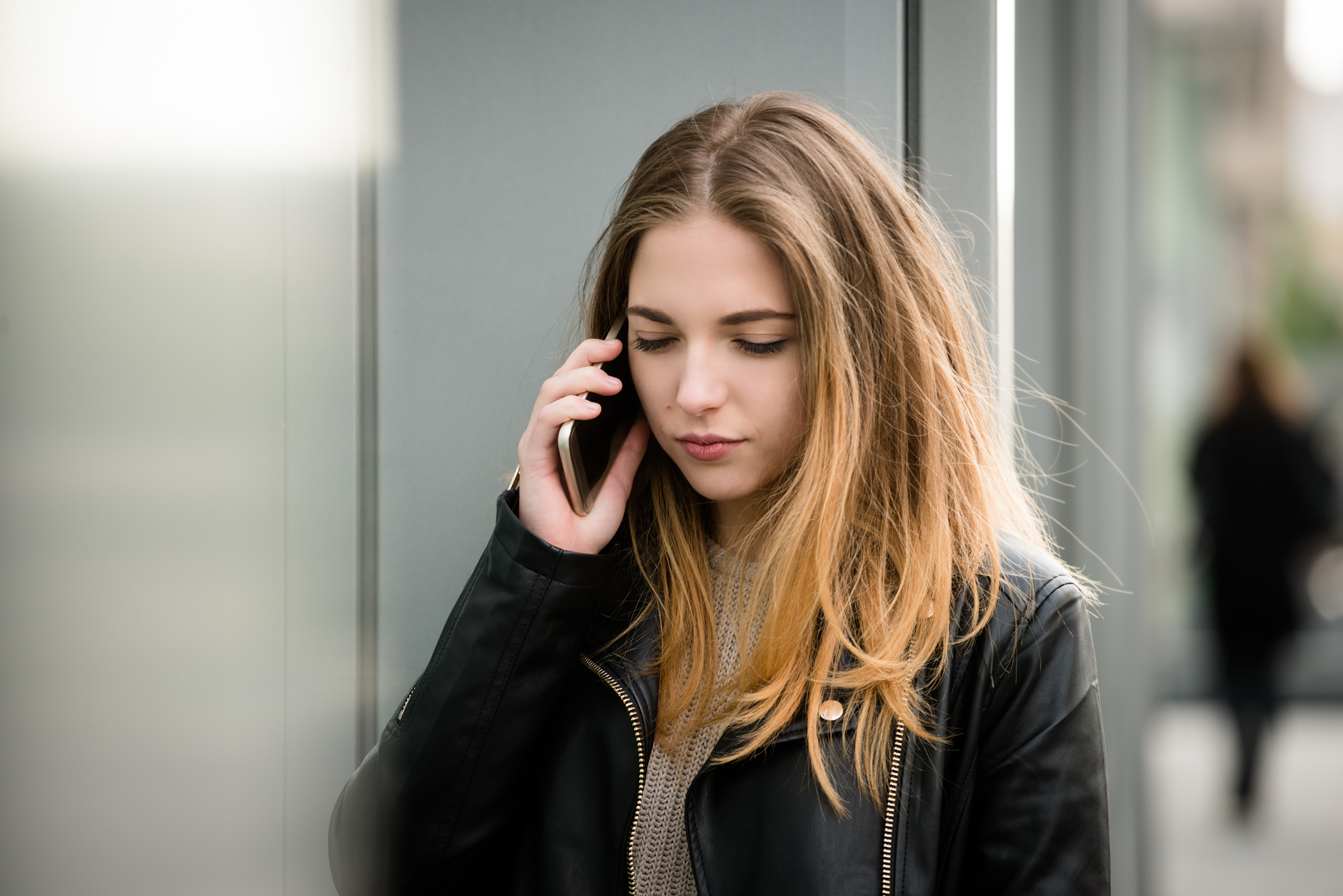 Young woman on phone. | Source: Shutterstock
