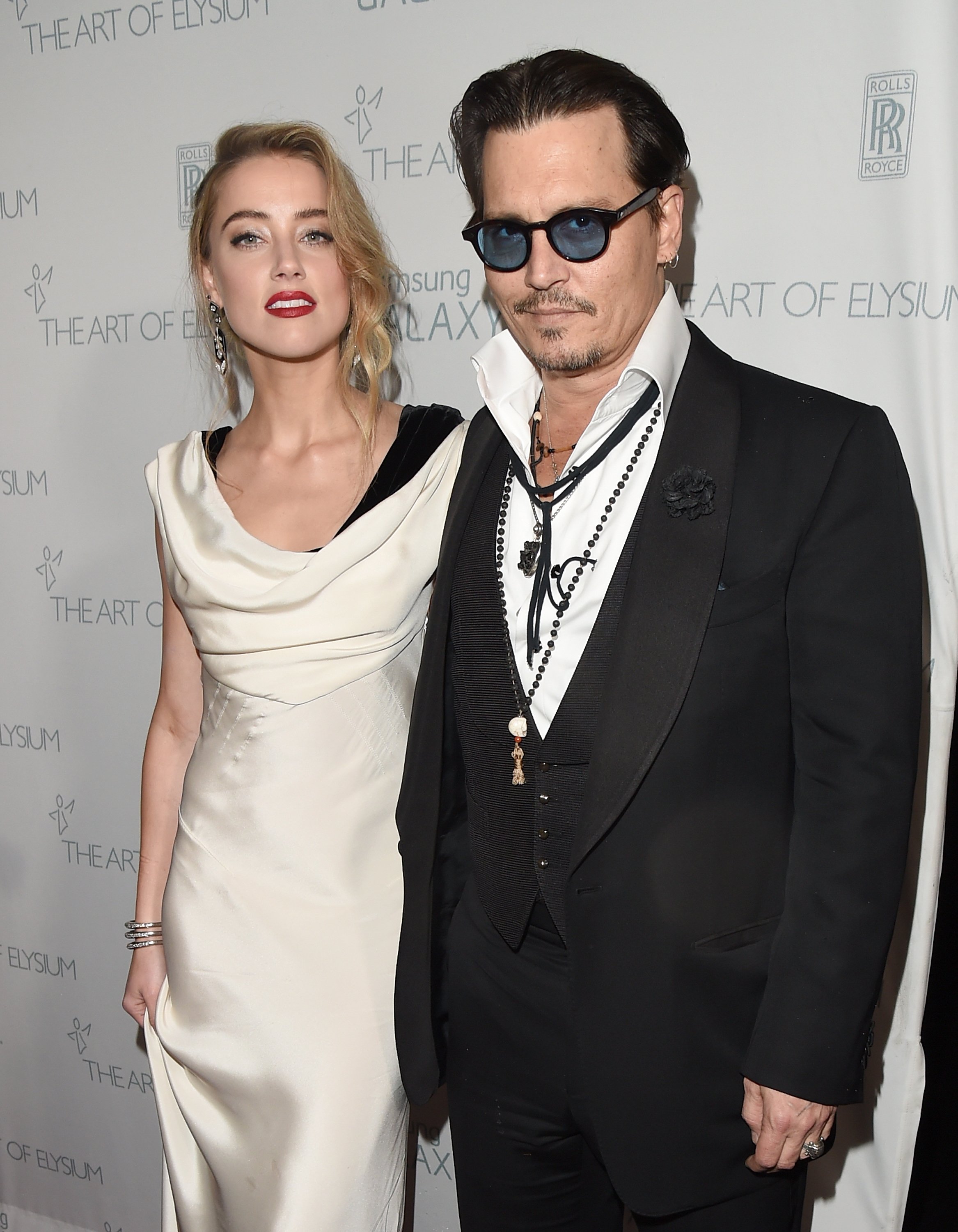 Actors Johnny Depp and Amber Heard at Hangar 8 on January 10, 2015 in Los Angeles, California | Source: Getty Images
