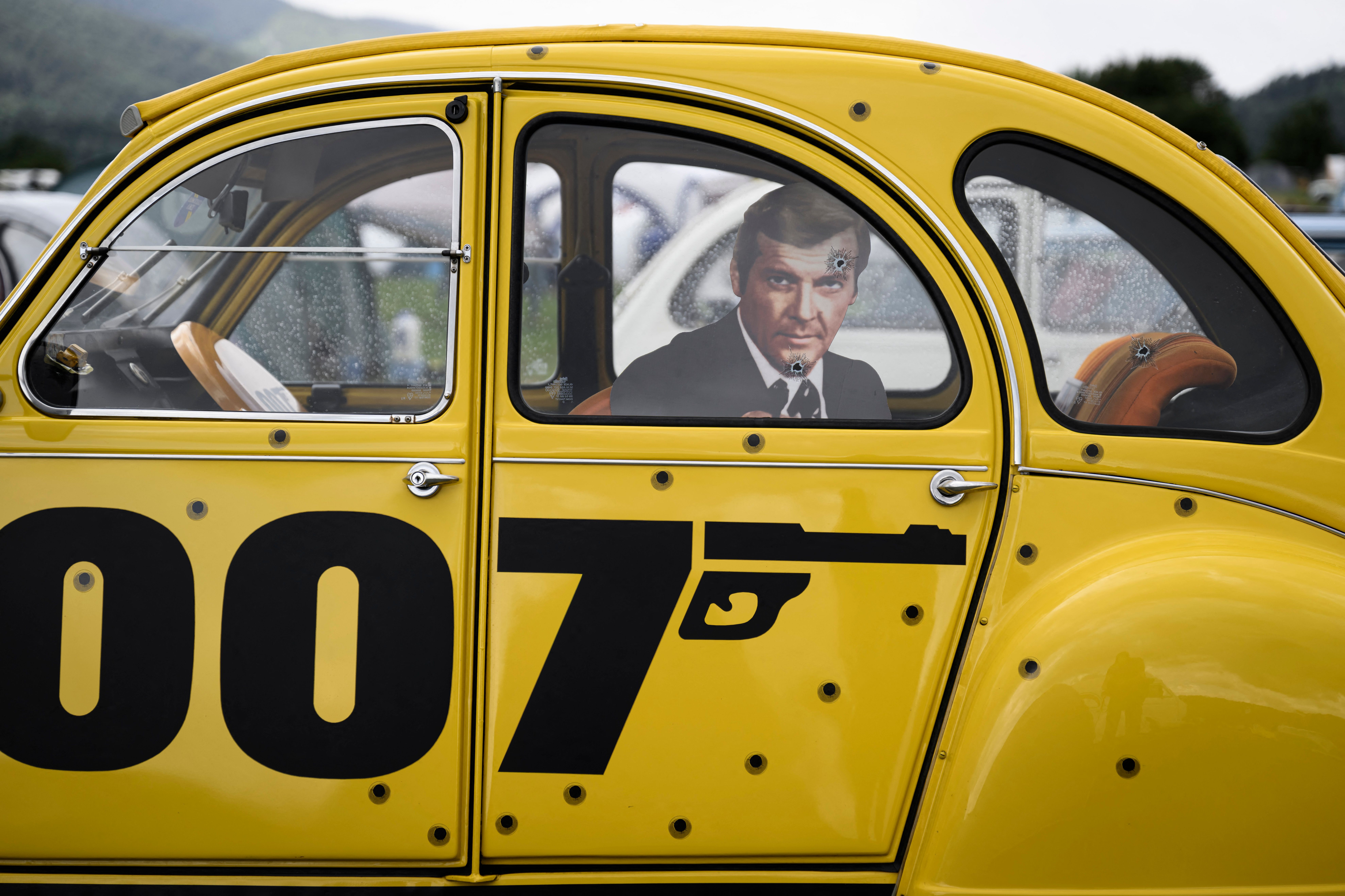 A car adorned with fictional cinema character "James Bond" themed decoration in Delemont, northern Switzerland on July 26, 2023. | Source: Getty Images