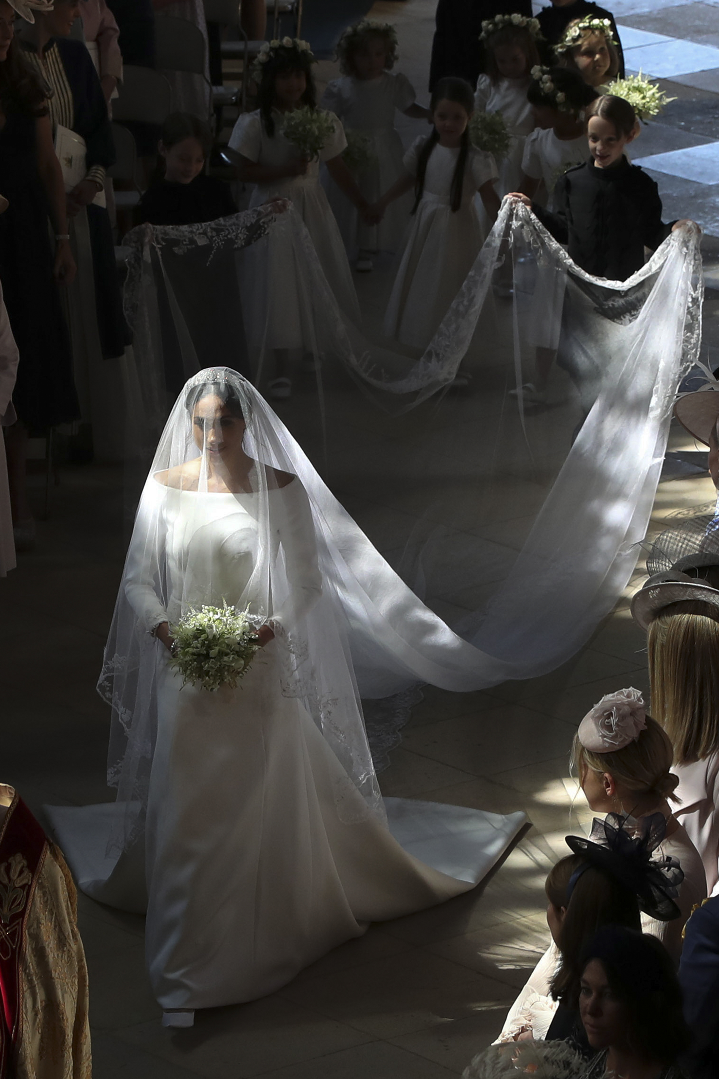 Meghan Markle walks down the aisle during her wedding to Prince Harry, Duke of Sussex in St George's Chapel, Windsor Castle, in Windsor, on May 19, 2018. | Source: Getty Images